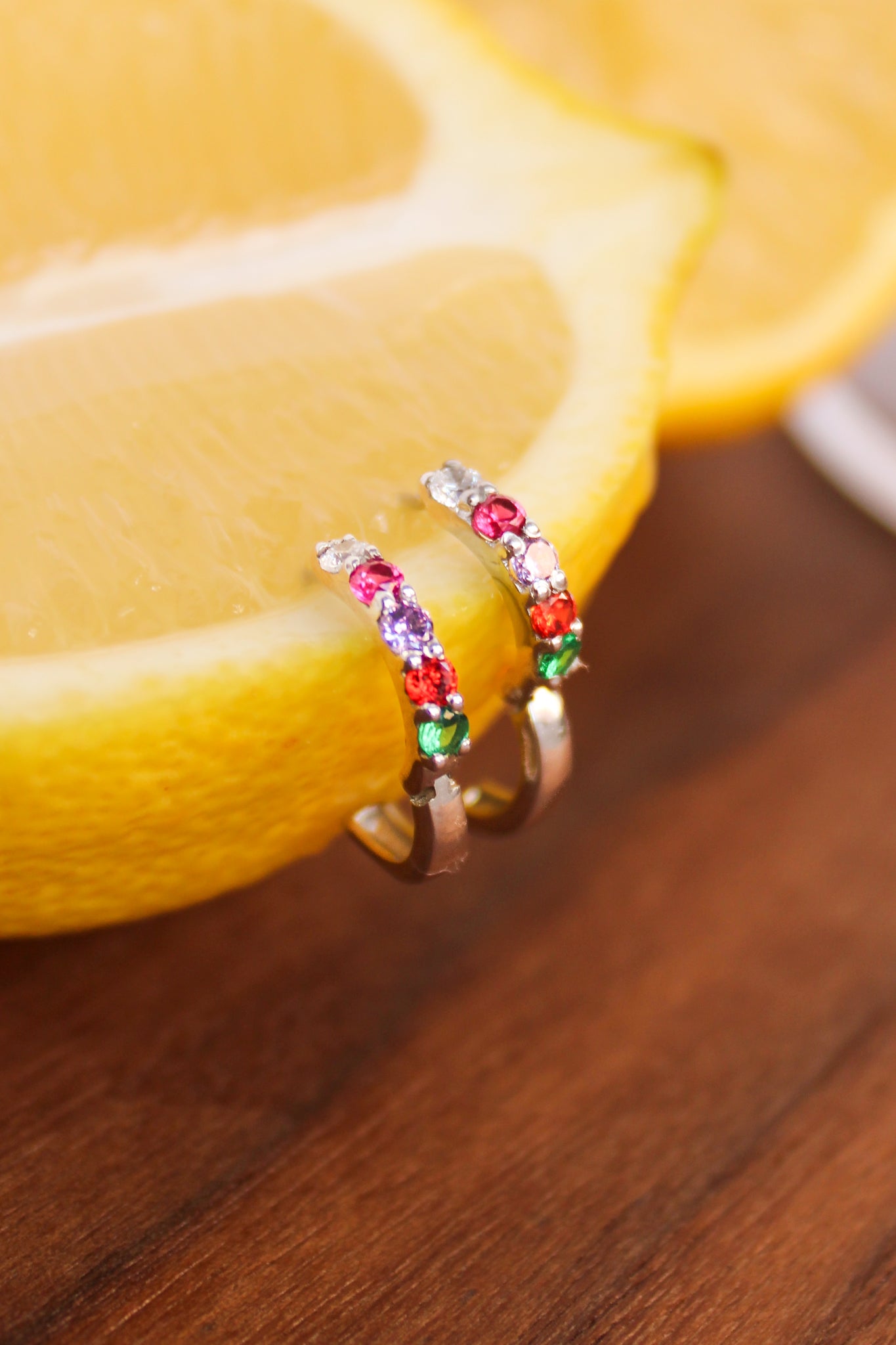 Regard Huggies in sterling silver styled in a lemon, acrostic CZ huggie hoop earrings, Ether Jewelry
