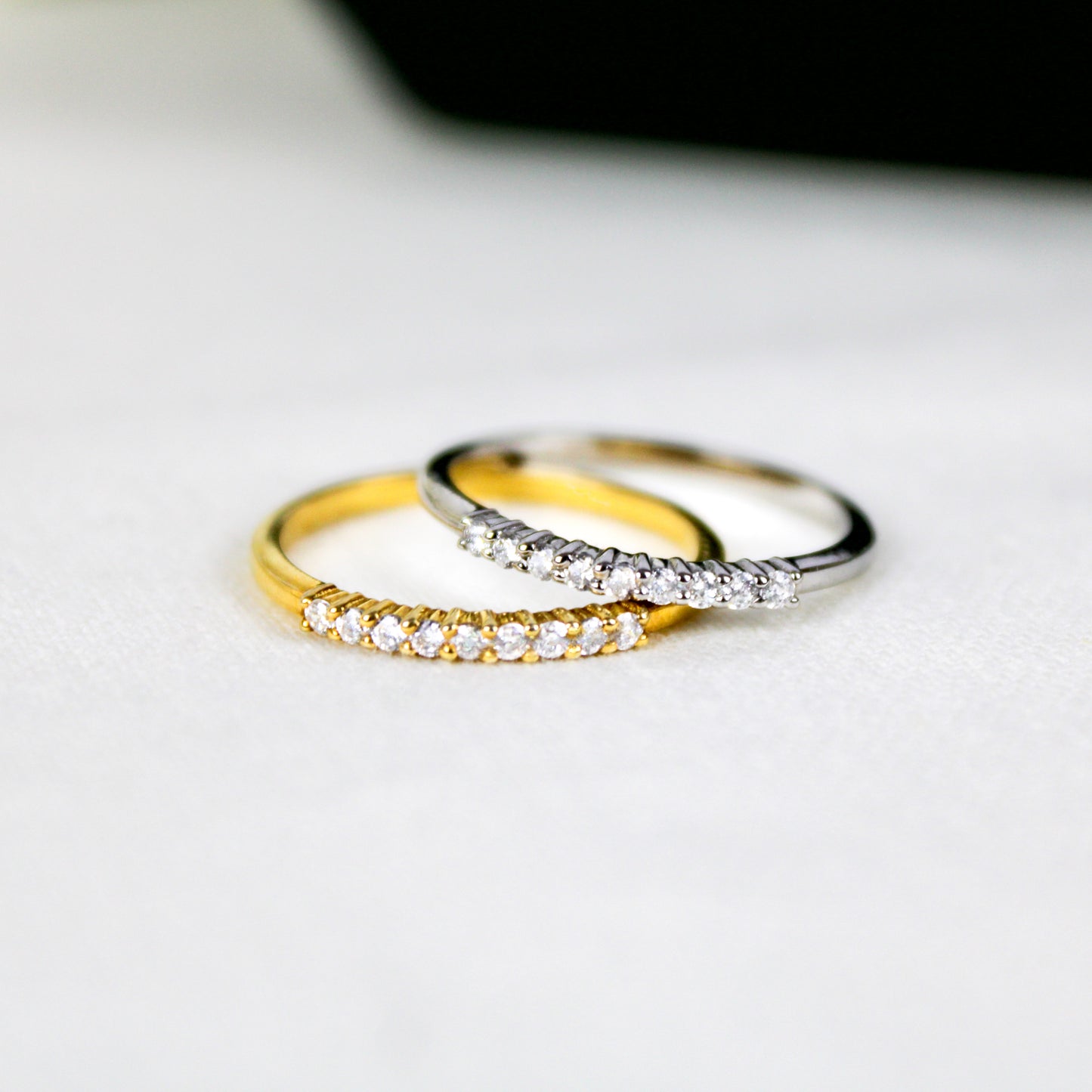 Heirloom Arc Stacker sterling silver and gold vermeil stacking rings laid on top of each other, Ether Jewelry