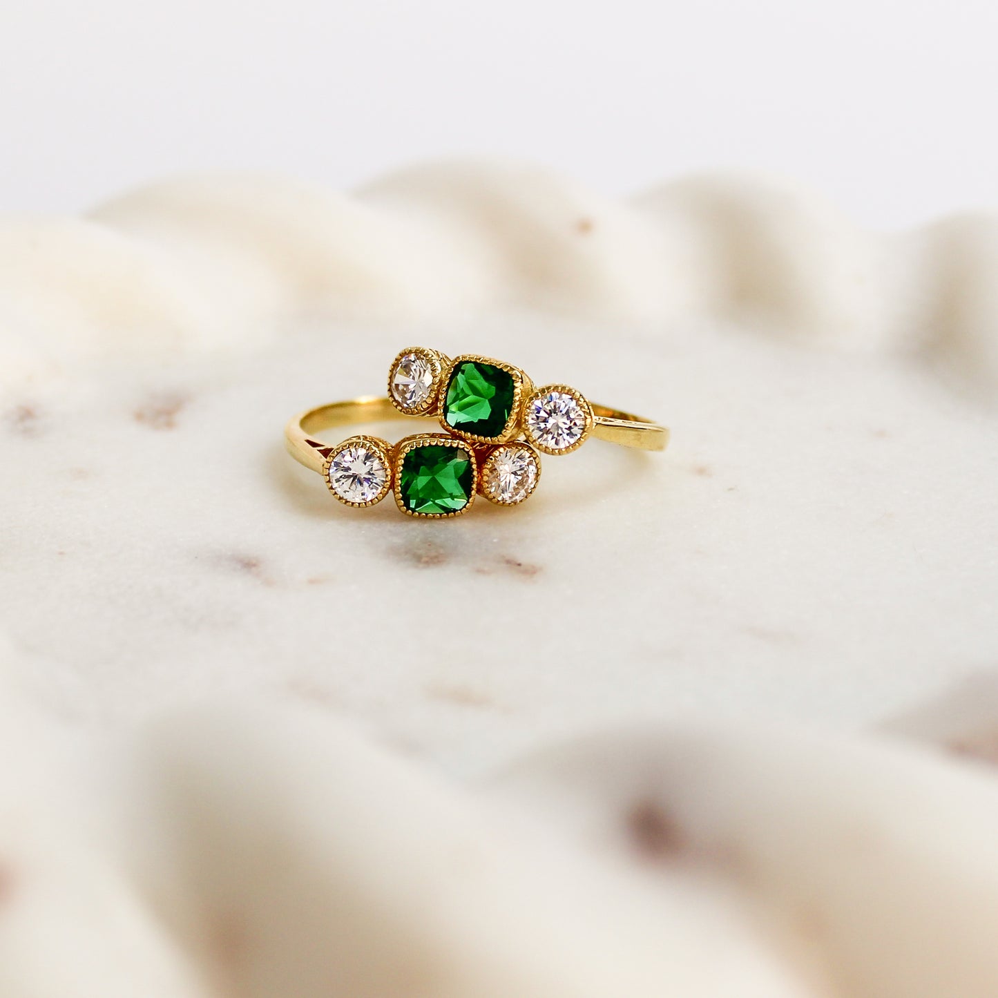 Edwardian Three Stone 18k gold vermeil ring stacked on stone tray, Ether Jewelry