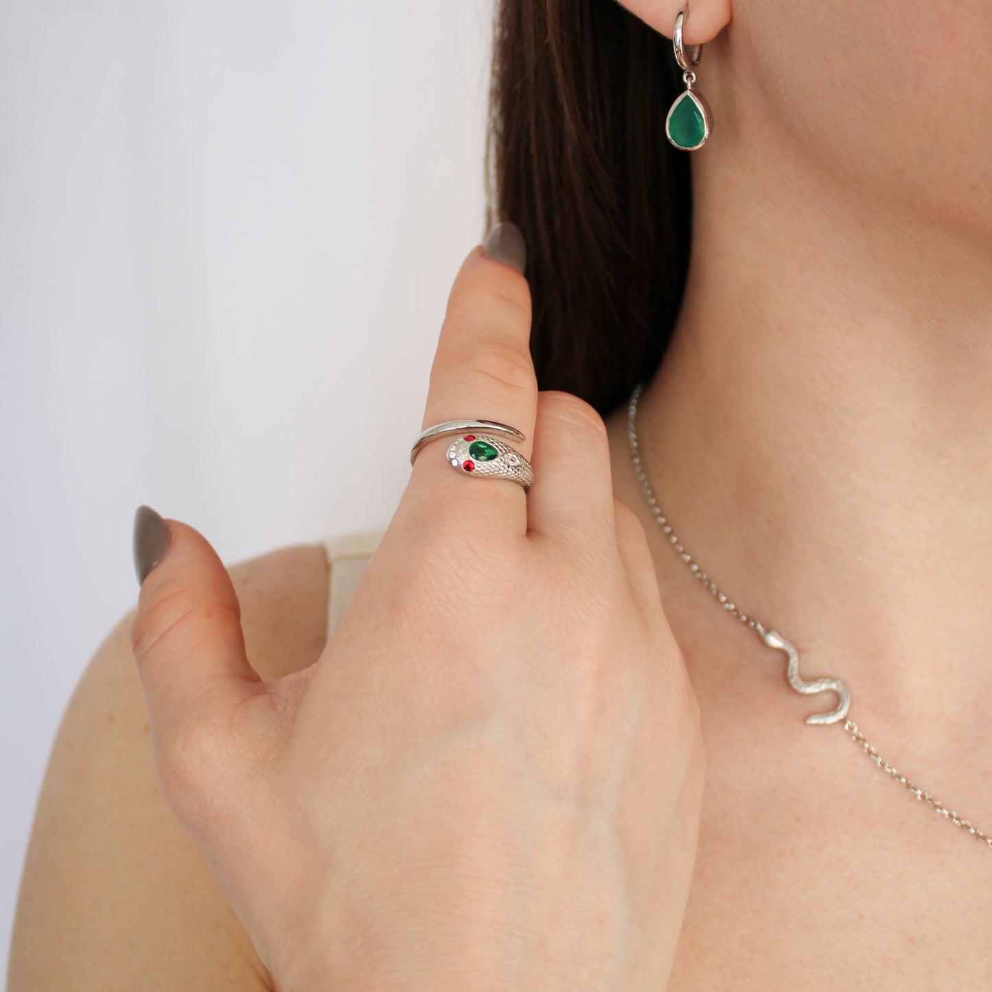 Queen Victoria snake ring in sterling silver on model hand, lifestyle shot, Ether Jewelry
