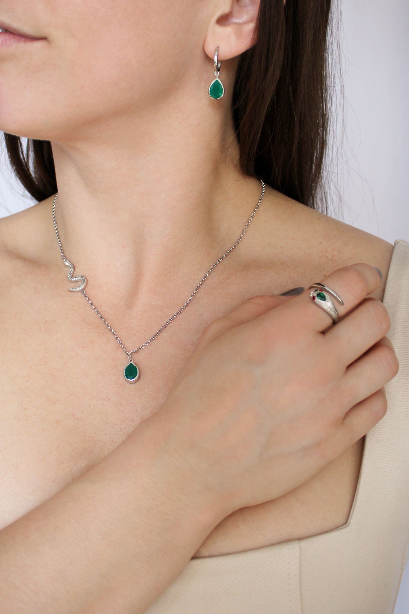 Devoted sterling silver necklace, earrings, and ring worn together on model, green onyx serpent jewelry set, Ether Jewelry