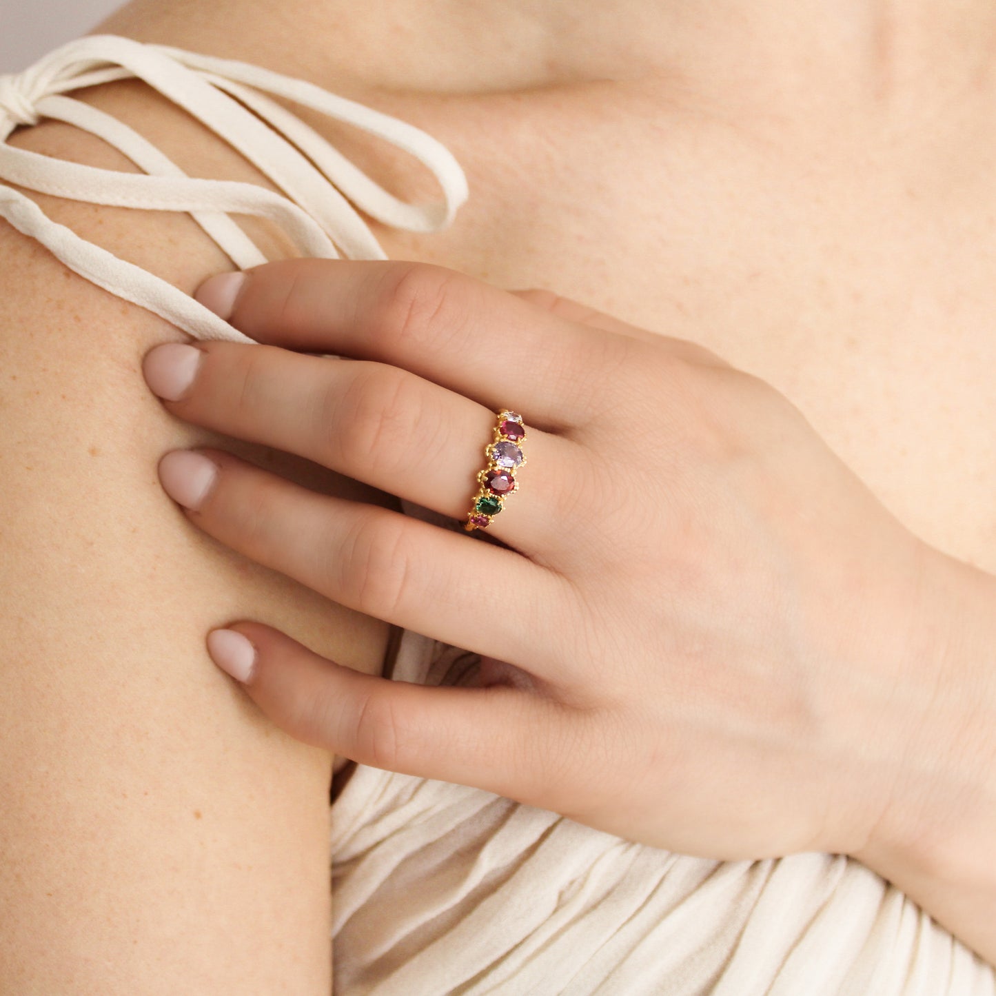 Crowned Jewel Ring 18k gold vermeil on model holding straps of dress wearing ring, REGARD acrostic oval CZ jewelry, Ether Jewelry