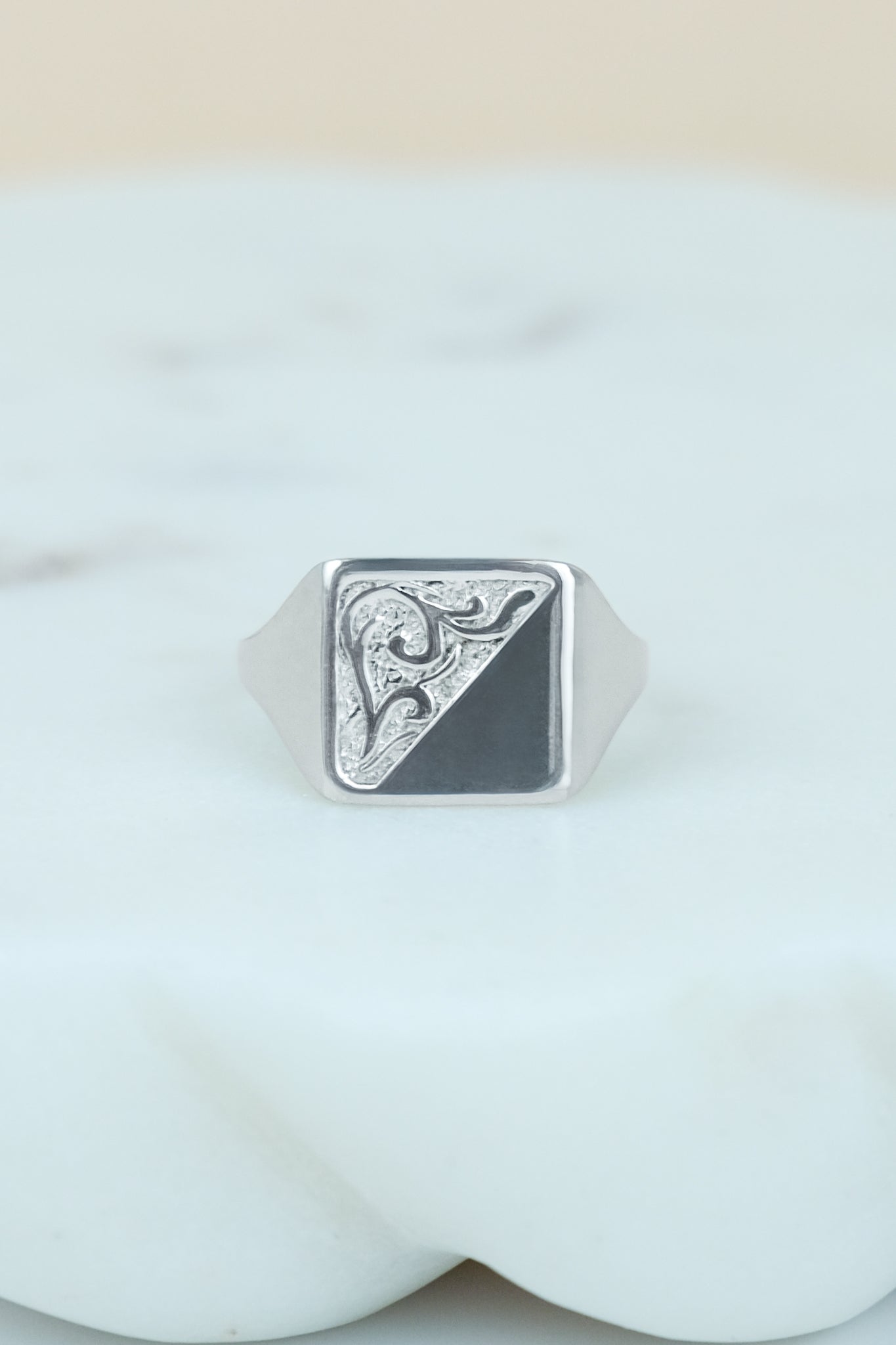 sterling Silver architect square signet ring with geometric design on a marble background
