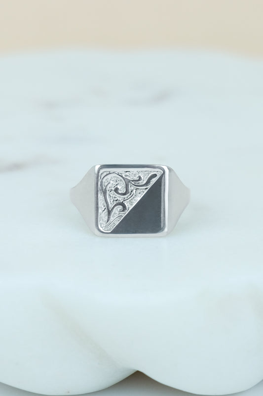 sterling Silver architect square signet ring with geometric design on a marble background