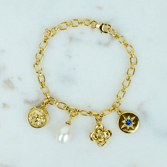 The Archivist Charm Bracelet with double linked chain and four detachable charms in gold plated sterling silver