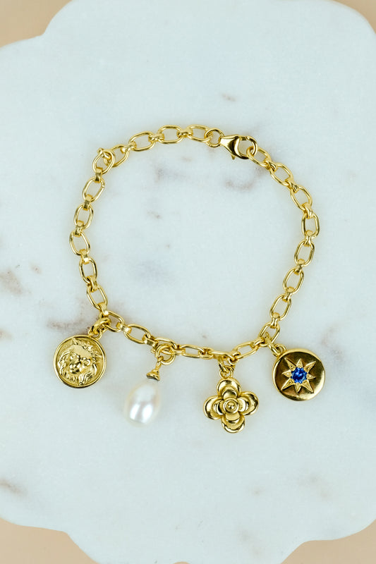 The Archivist Charm Bracelet with double linked chain and four detachable charms in gold plated sterling silver