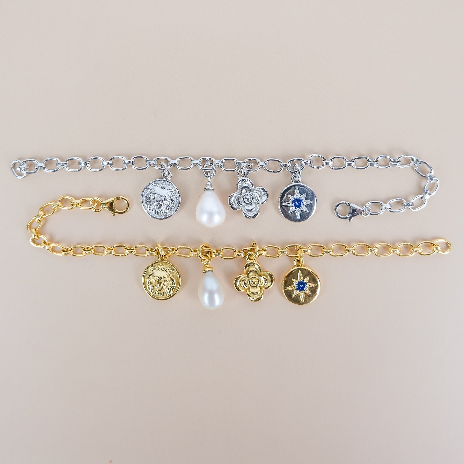 Archivist Bracelet sterling silver and gold vermeil both bracelets on beige background, multi-charm oval link bracelet, Ether Jewelry
