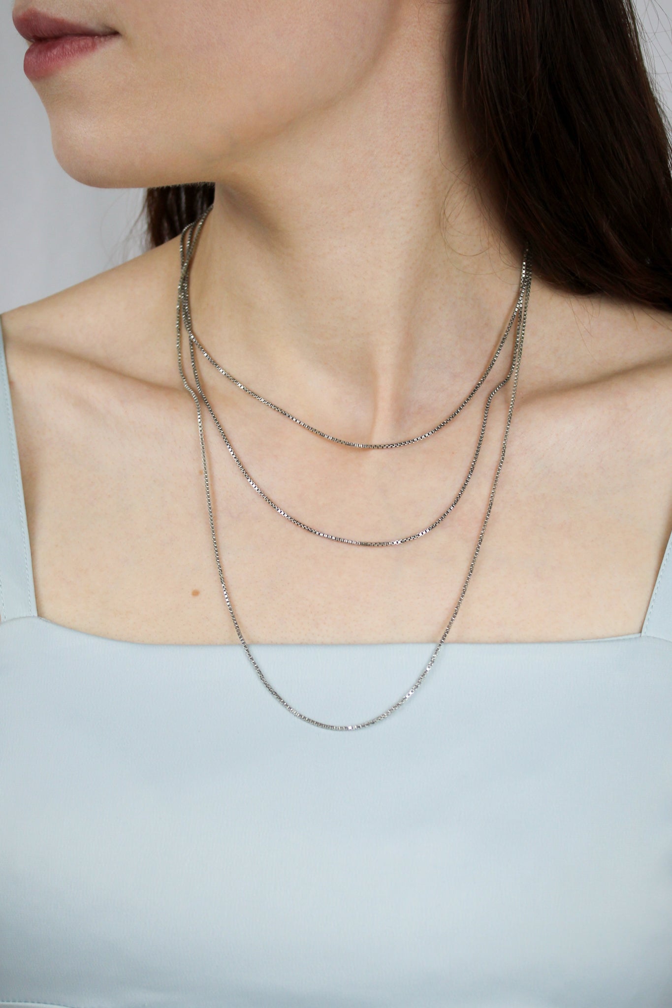 Silver Chain Necklace styled on model layered subtly for modern sophistication.