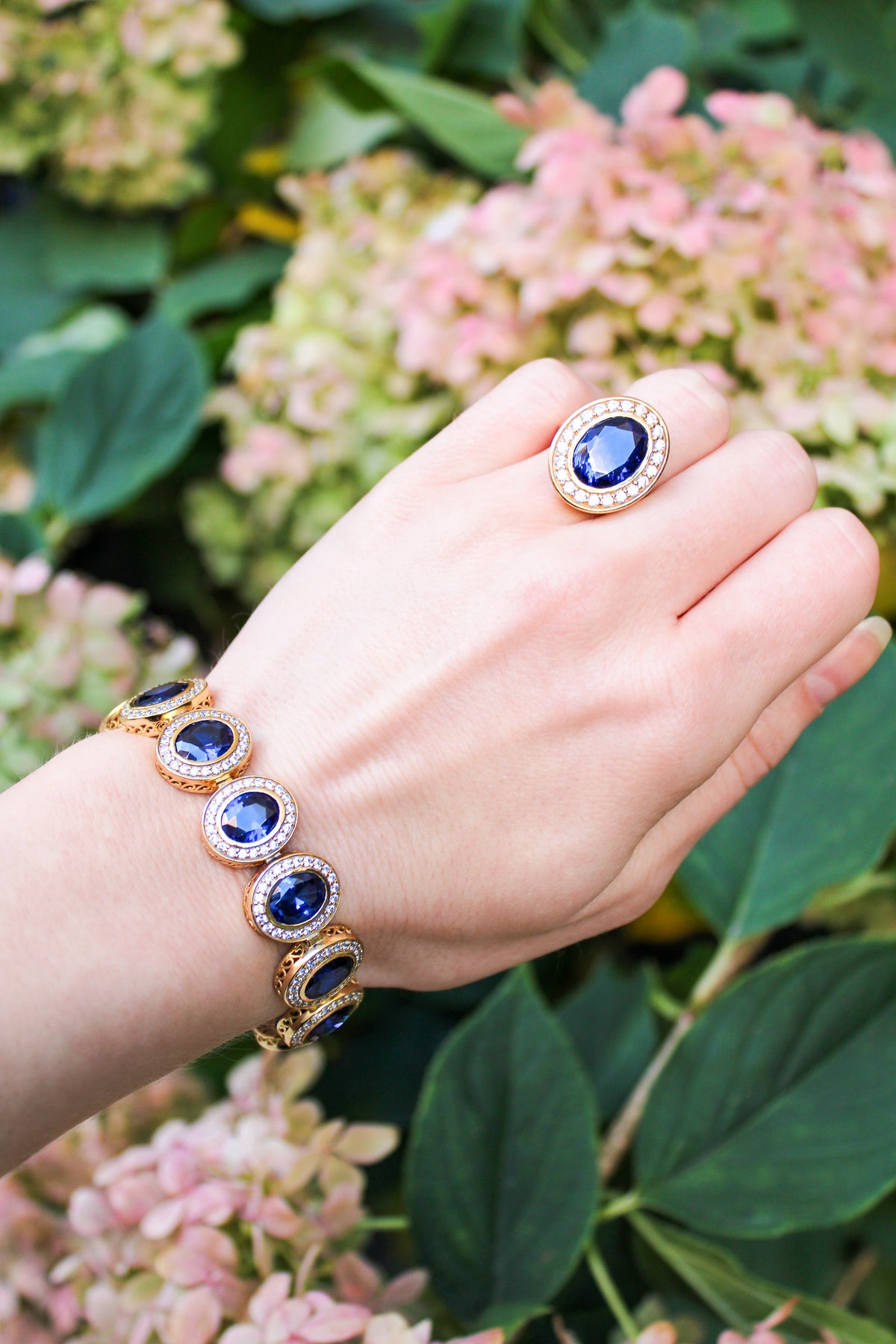 Close-up of gold Halo Bracelet on model’s wrist, radiant stations shimmering with every movement, Ether Jewelry
