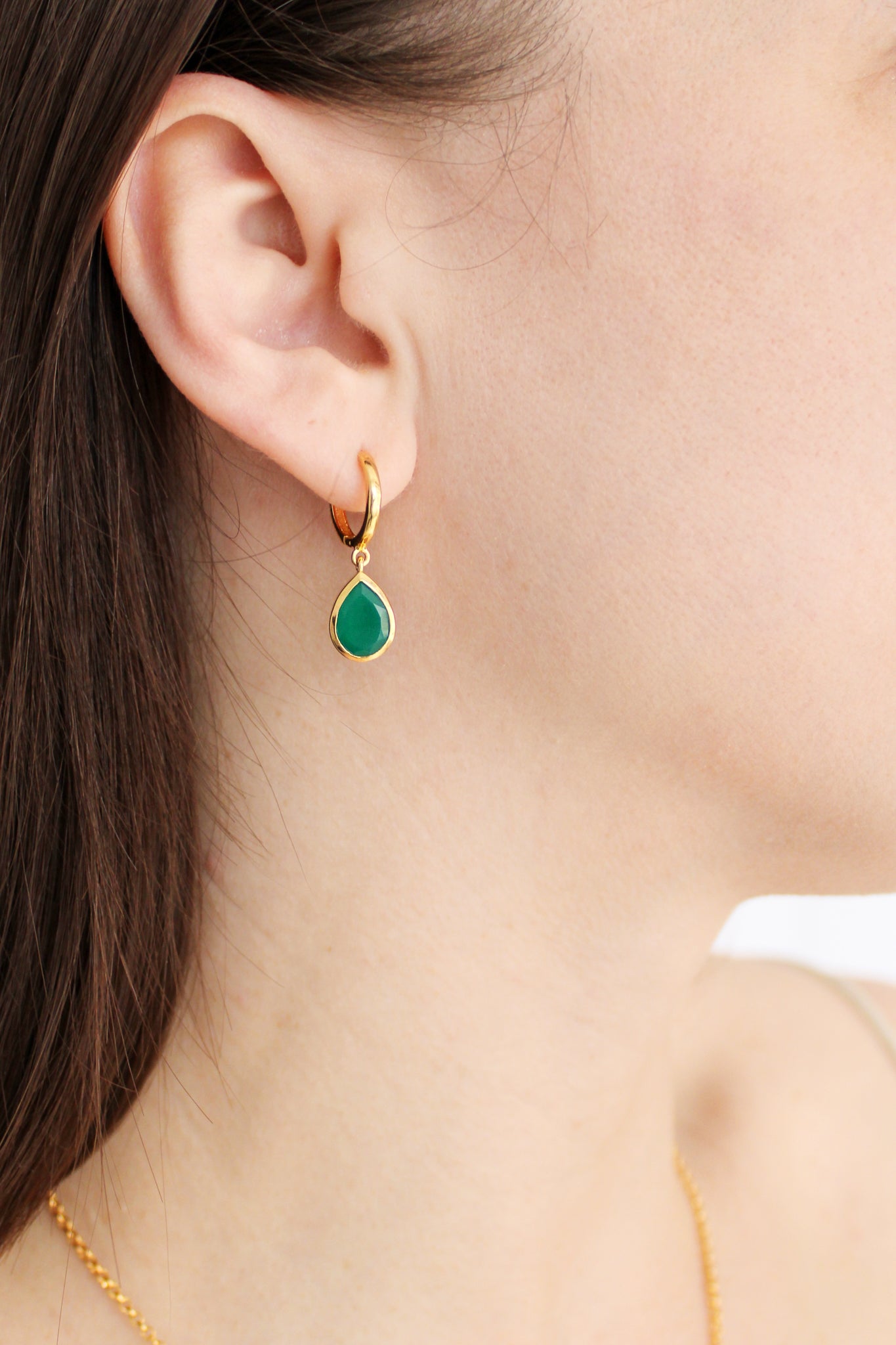 Devoted Earrings in 18k gold vermeil worn on model, green onyx teardrop huggie hoop earrings front view, Ether Jewelry