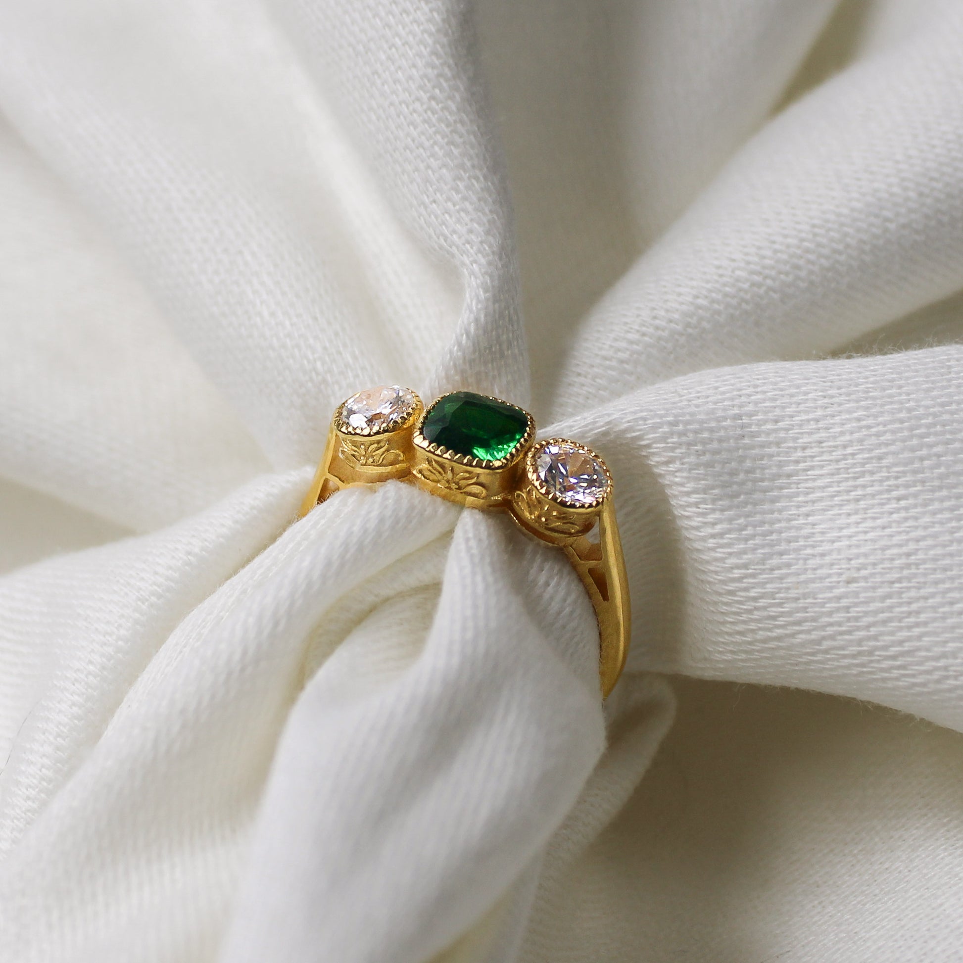 Edwardian Three Stone 18k gold vermeil ring wrapped around fabric showing filigree detail, green CZ milgrain bezel ring, Ether Jewelry