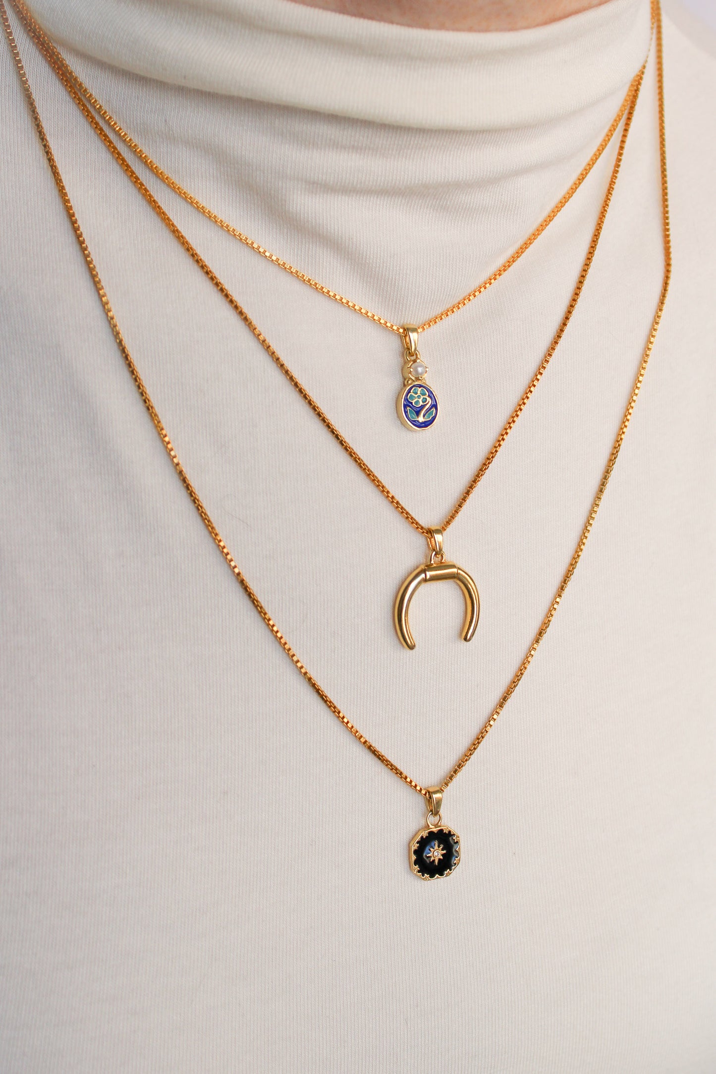 Ether Necklace in 18k gold vermeil layered with different length necklaces on model, Ether Jewelry