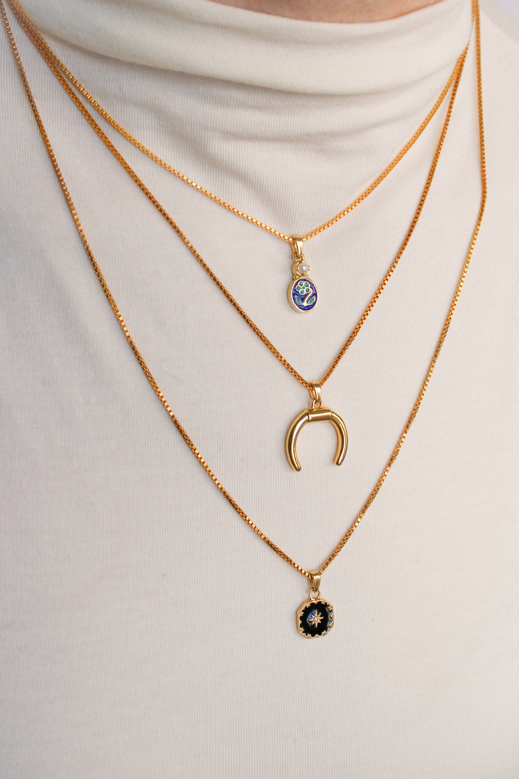 Ether Necklace in 18k gold vermeil layered with different length necklaces on model, Ether Jewelry