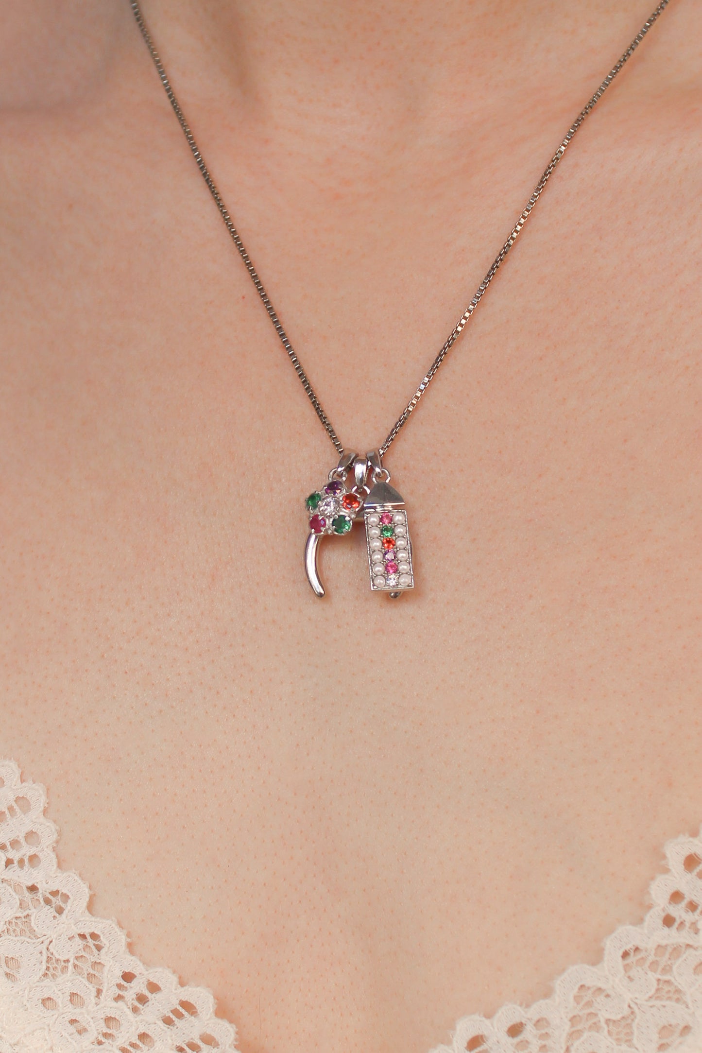 Sterling silver double horn pendant stacked with other pendants on same chain, Ether Jewelry