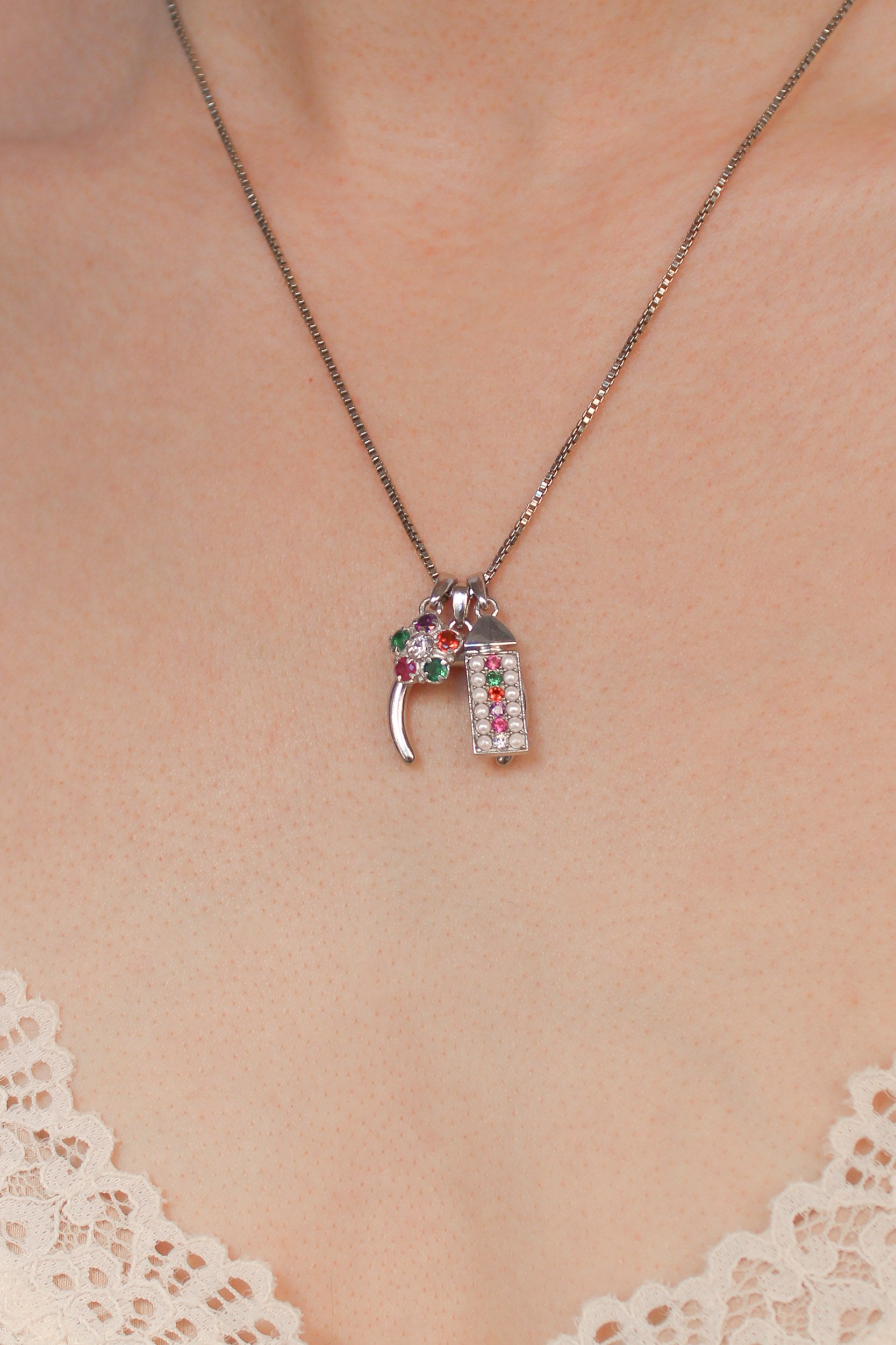 Sterling silver double horn pendant stacked with other pendants on same chain, Ether Jewelry