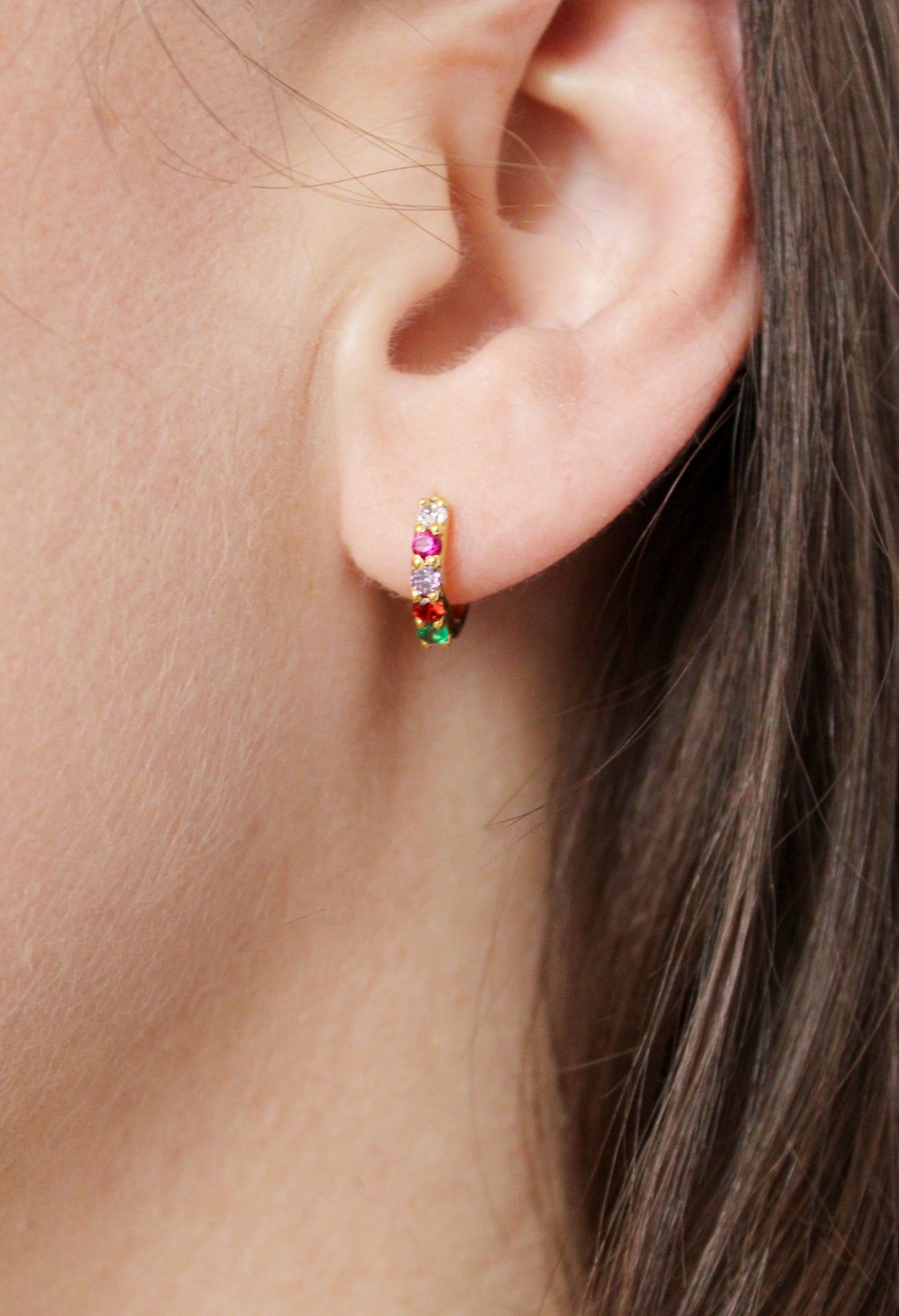 Regard Huggies in 18k gold vermeil on model ear, acrostic REGARD CZ huggie hoop earrings, Ether Jewelry