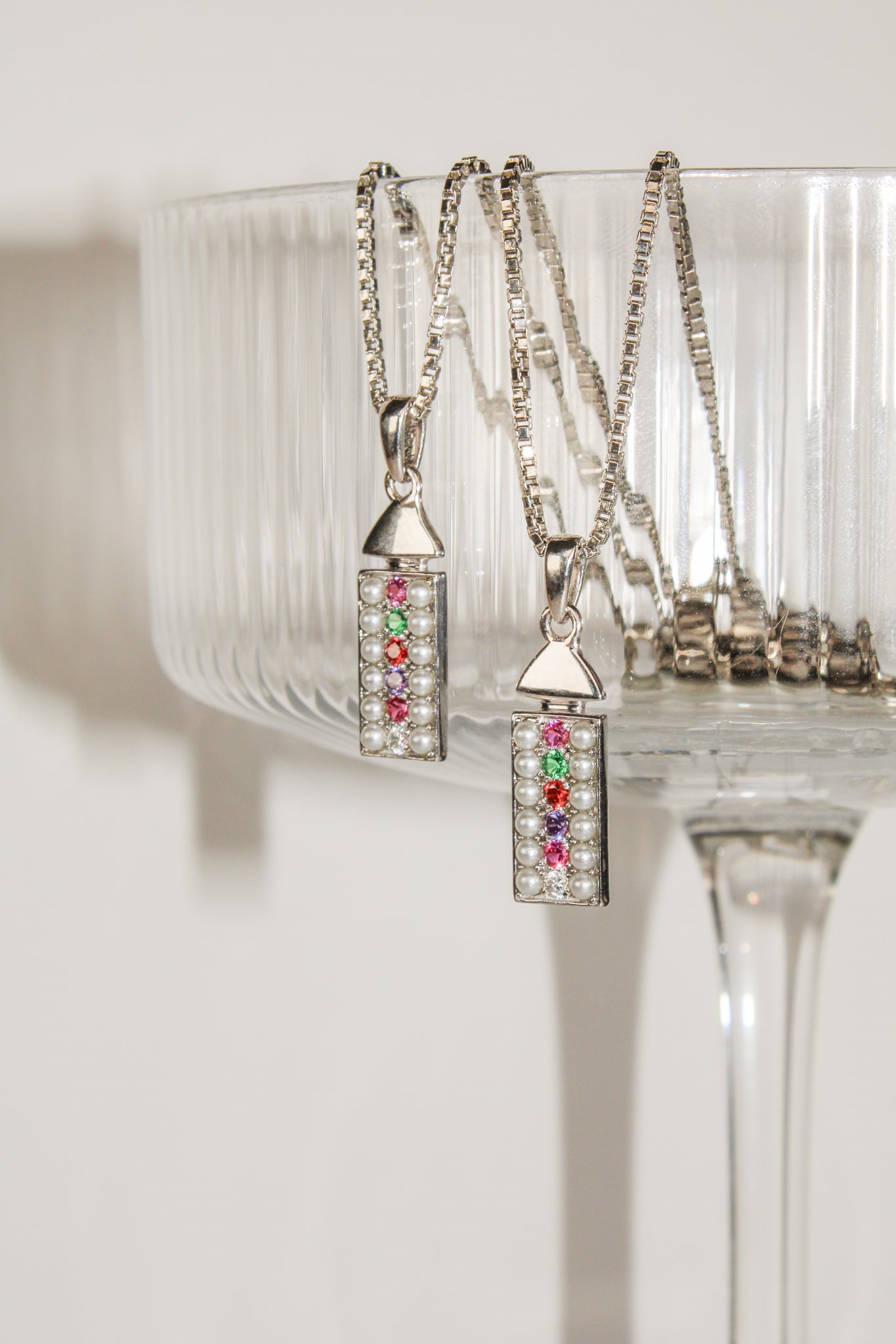 Regent sterling silver necklace handed off a glass, pearl-paved rectangular REGARD acrostic pendant, Ether Jewelry