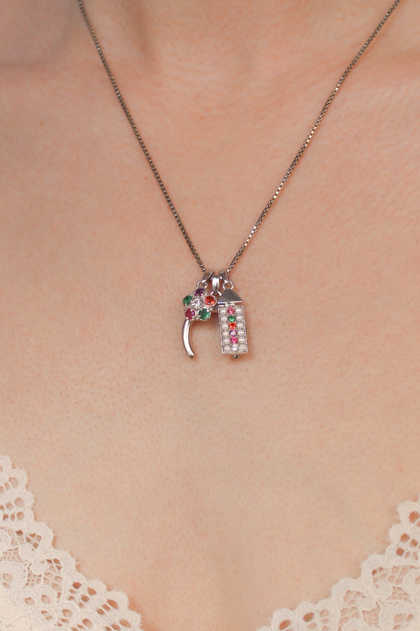 Regard Bloom sterling silver necklace stacked with other Regard pendants on same chain, acrostic jewelry layered look, Ether Jewelry