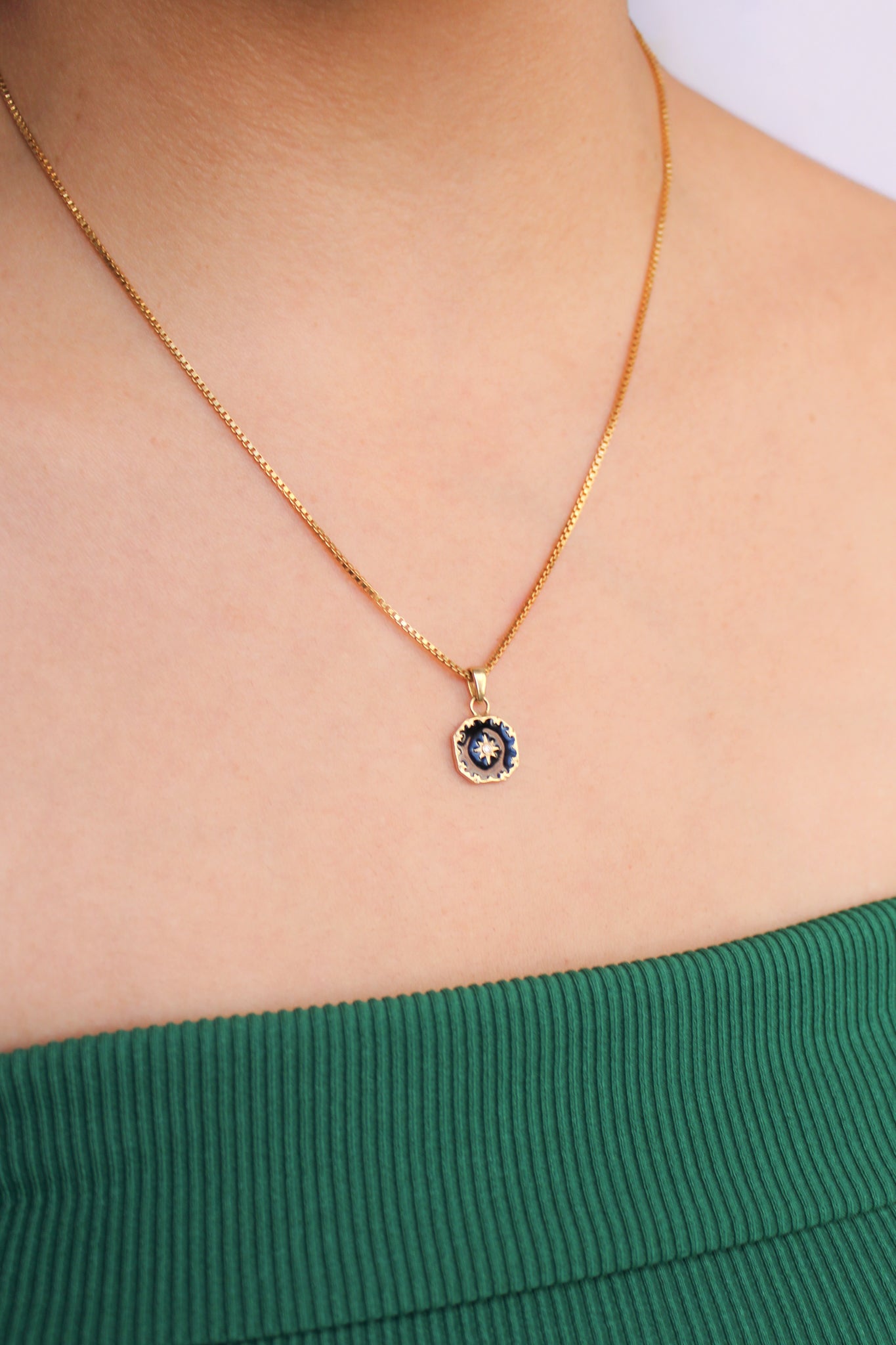 18k gold vermeil Nocturne Necklace on model, black enamel pendant side angle view, Ether Jewelry