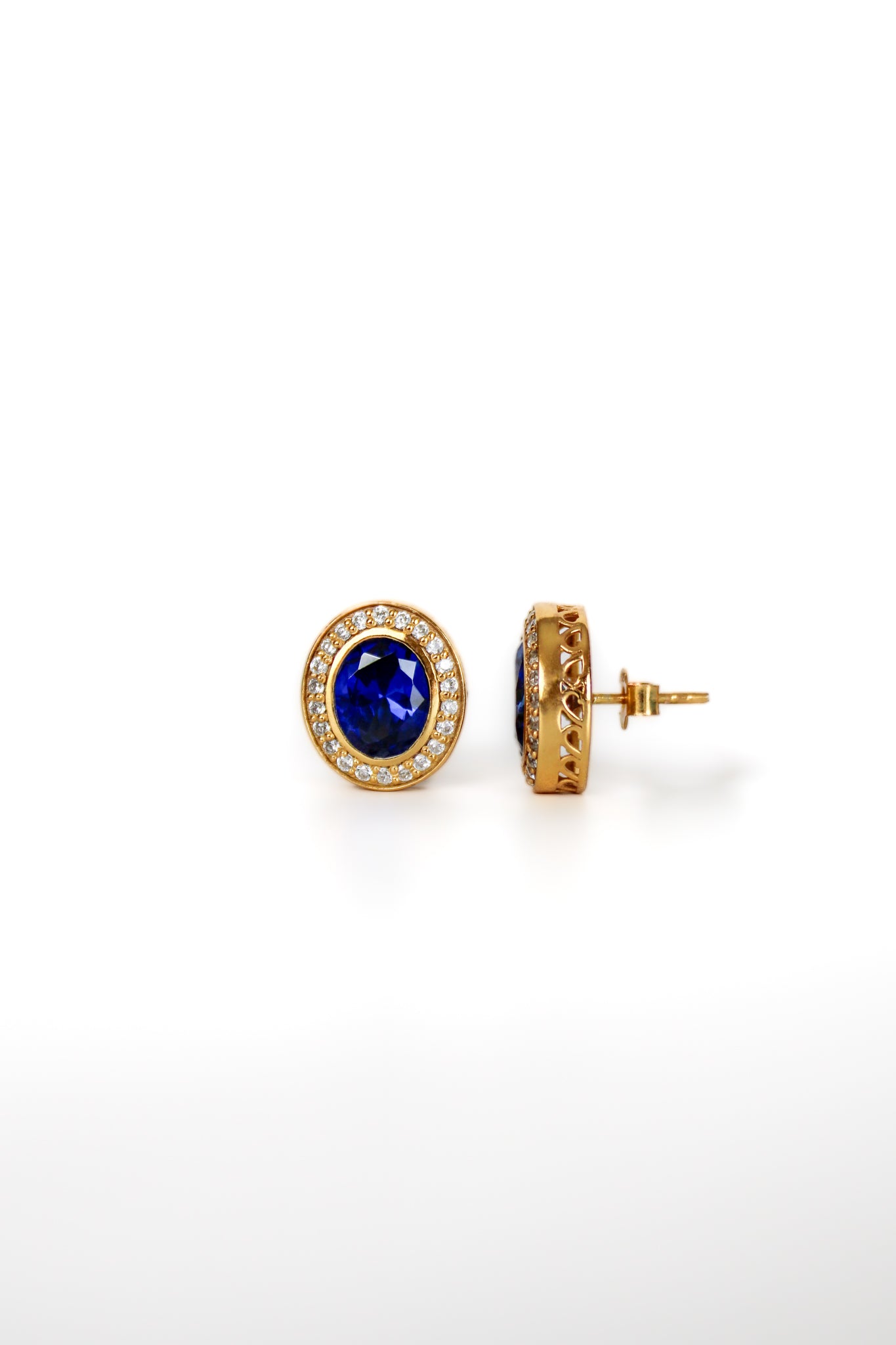 Gold Sovereign Stud Earrings with sapphire-toned center stones and radiant white halos inspired by Princess Diana.