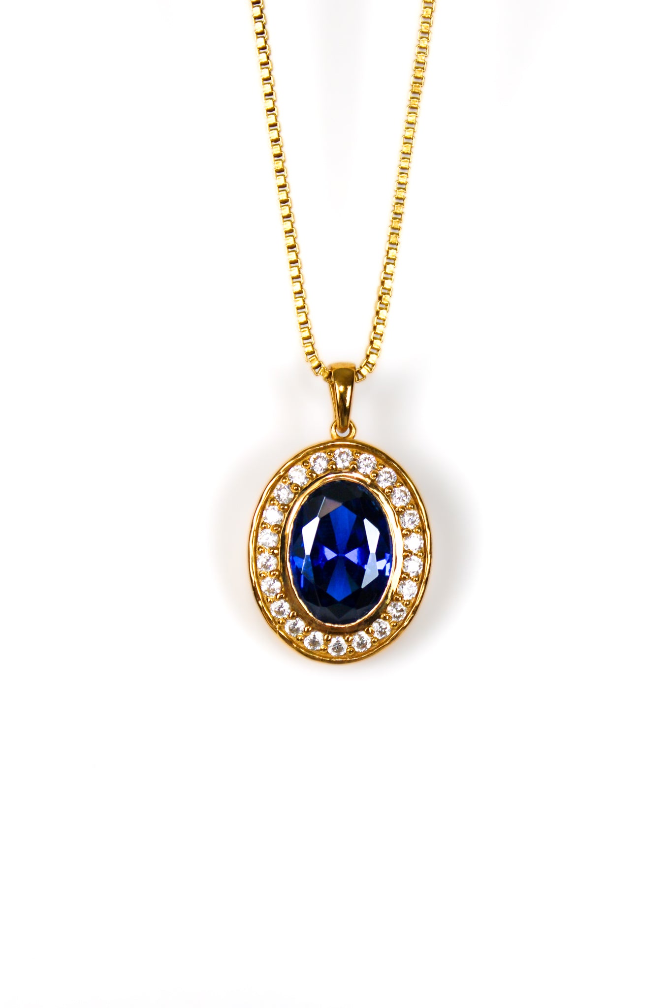 Gold Heartline Necklace with sapphire-toned gemstone and brilliant white accents inspired by Princess Diana’s elegance.