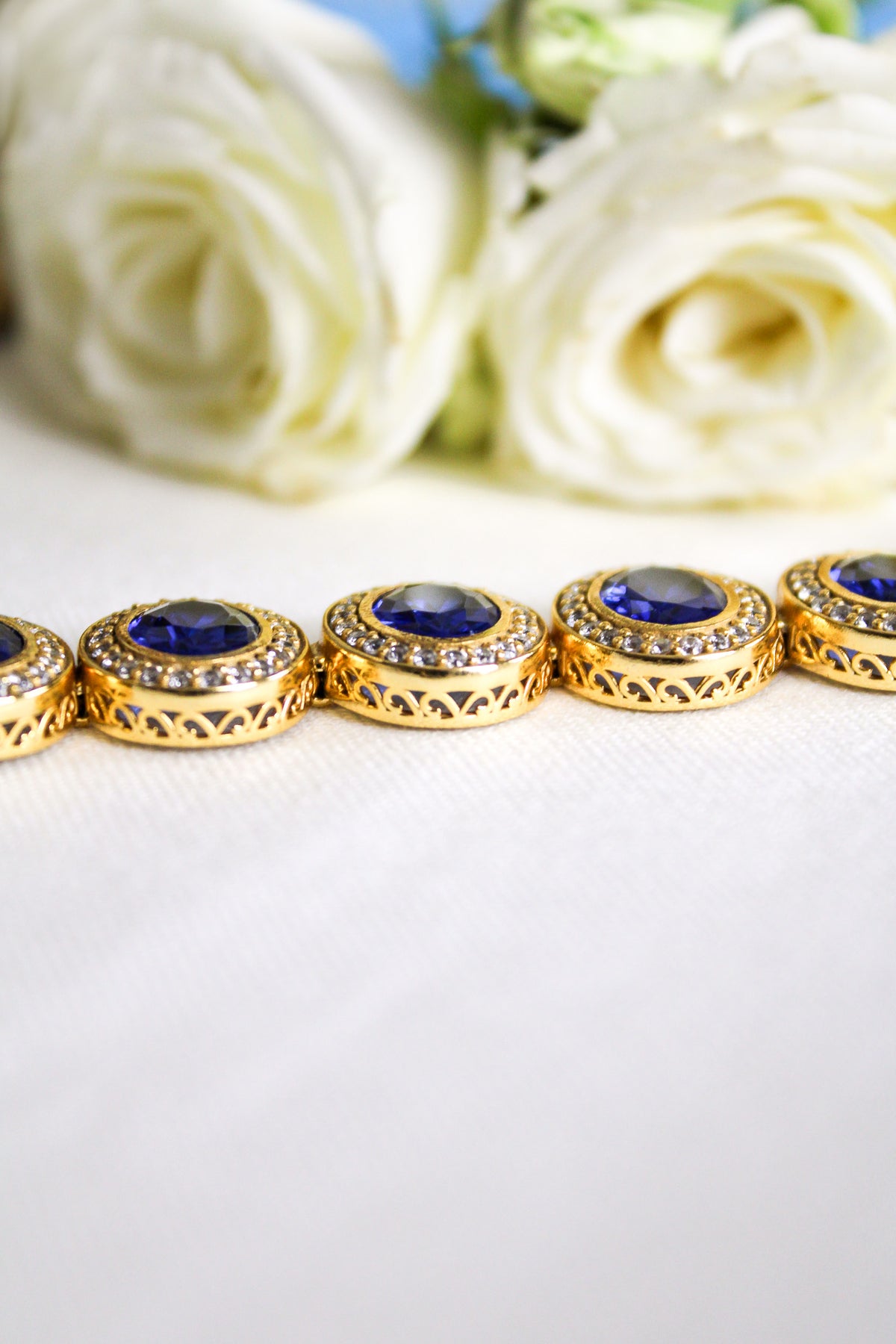 18k gold vermeil Halo Bracelet with luminous sapphire gemstones representing grace and light, Ether Jewelry