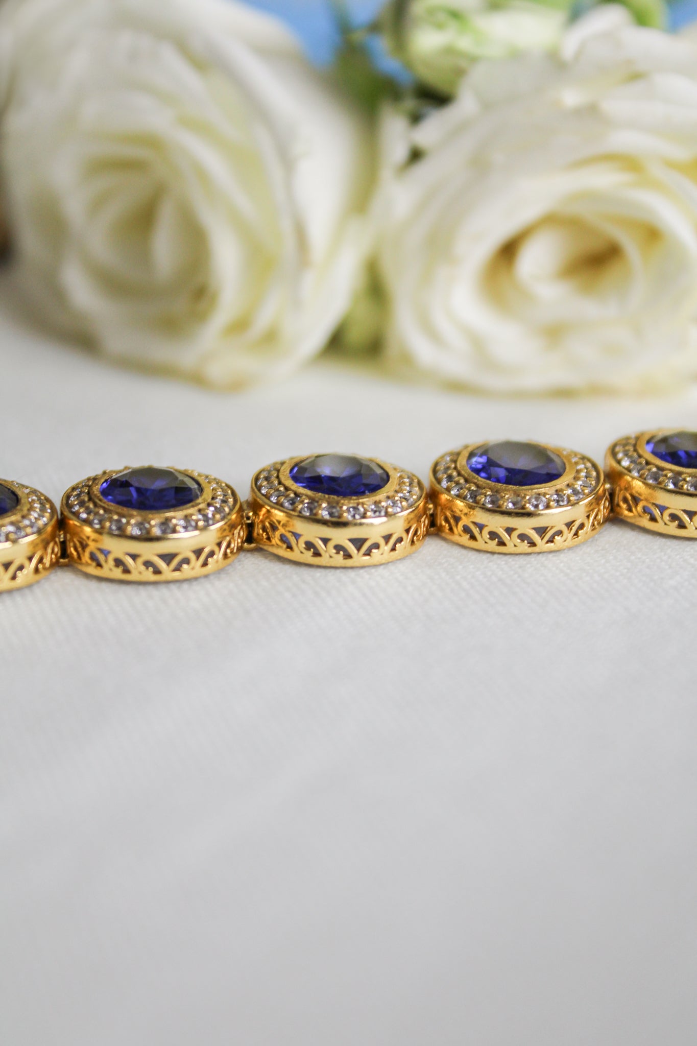 18k gold vermeil Halo Bracelet with luminous sapphire gemstones representing grace and light, Ether Jewelry