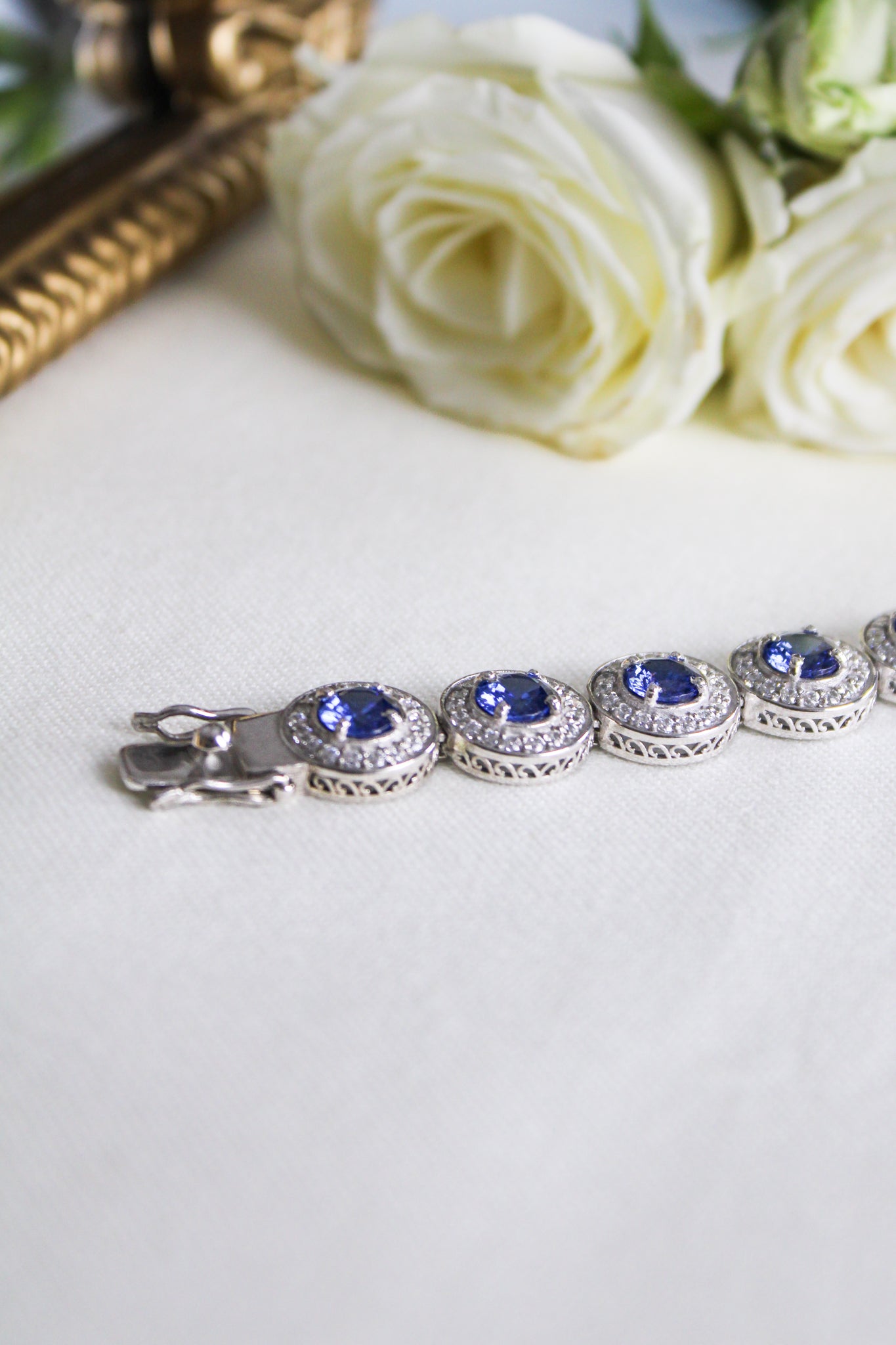 Close-up of silver Halo Bracelet with radiant halo stations and engraved detailing, Ether Jewelry