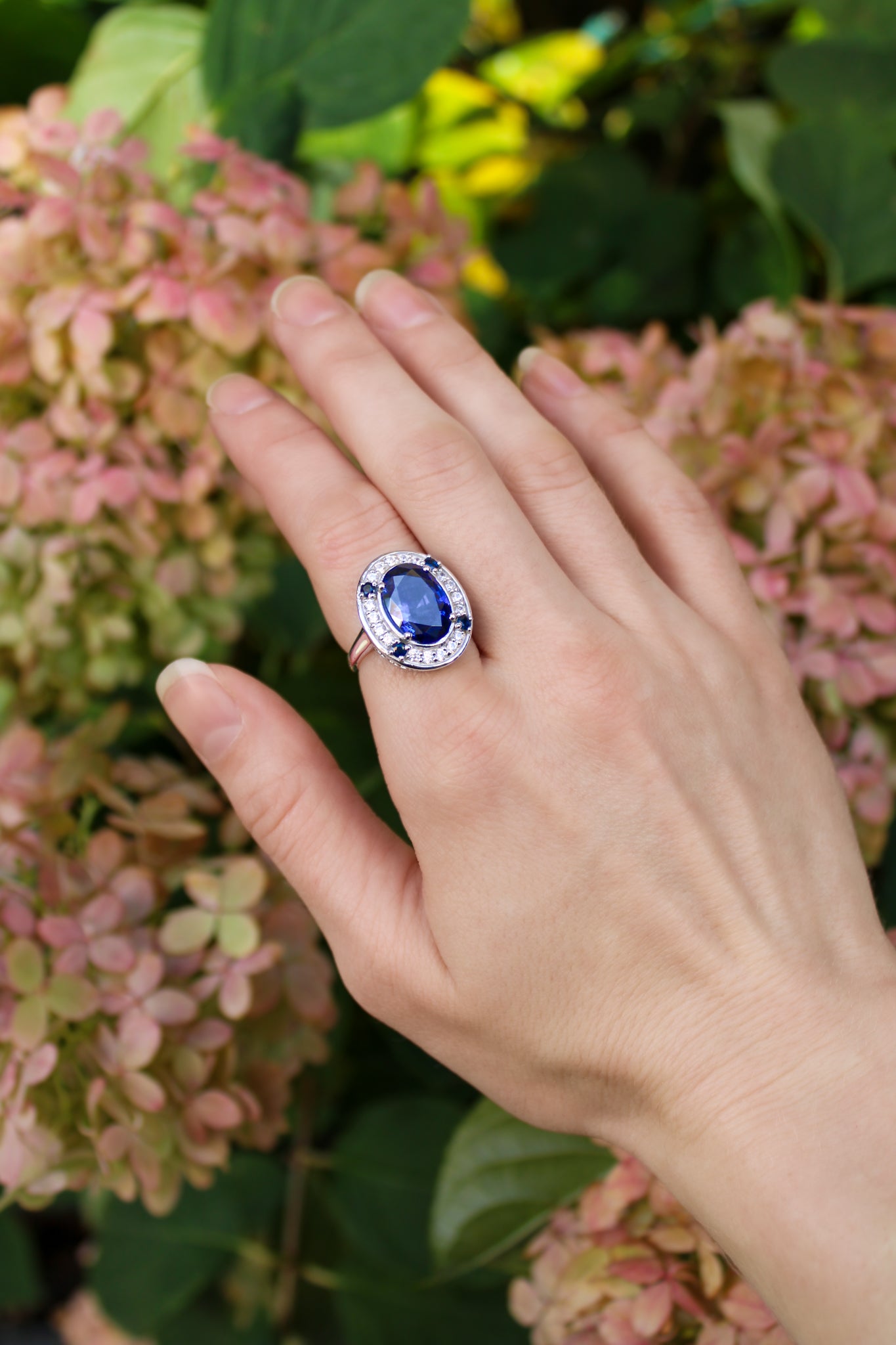 Model wearing The Legacy Ring in sterling silver, sapphire gemstone glimmering softly — timeless elegance inspired by Princess Diana.