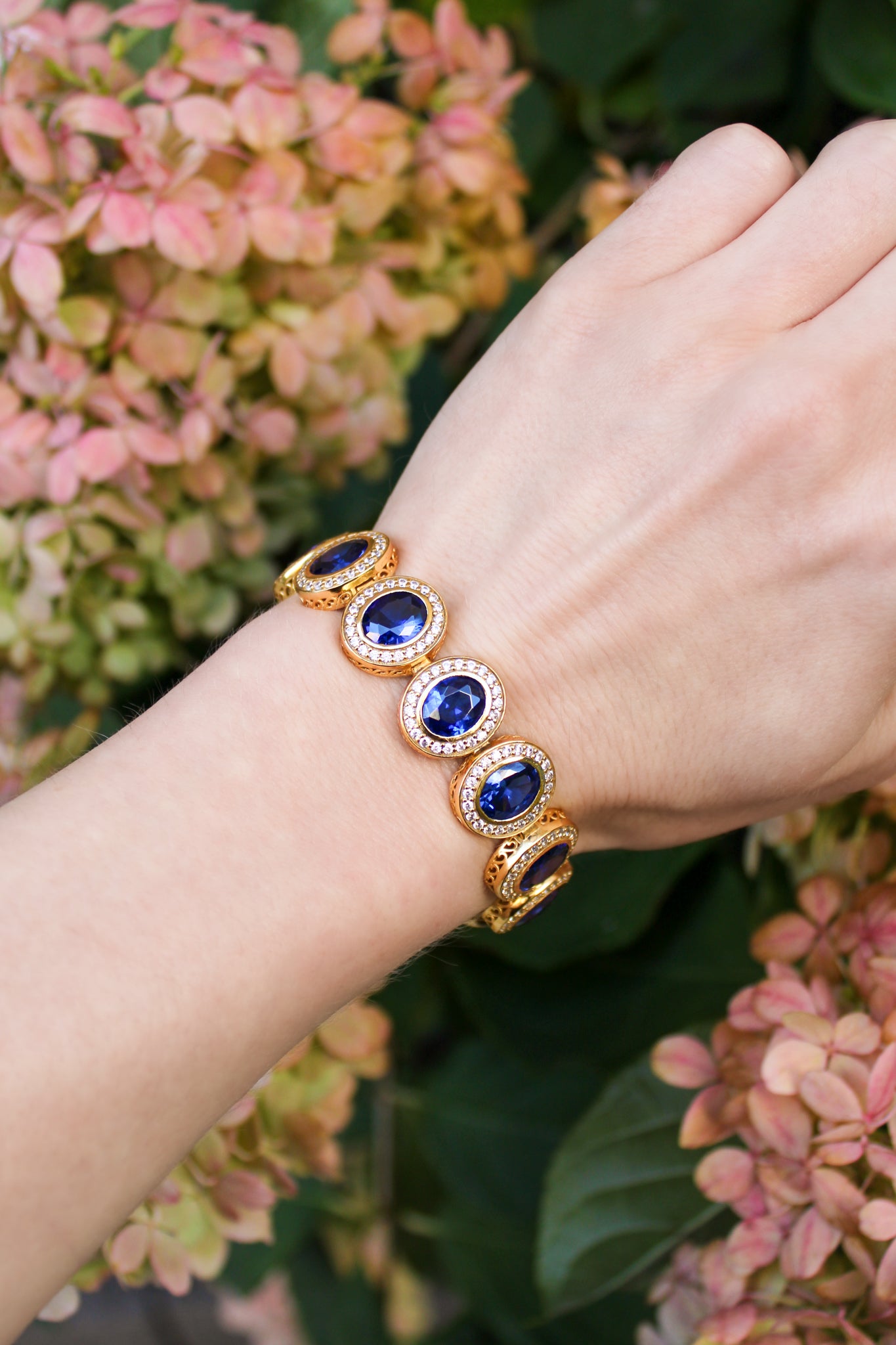 Detailed macro of gold Halo Bracelet showing fine craftsmanship and radiant halo stations.