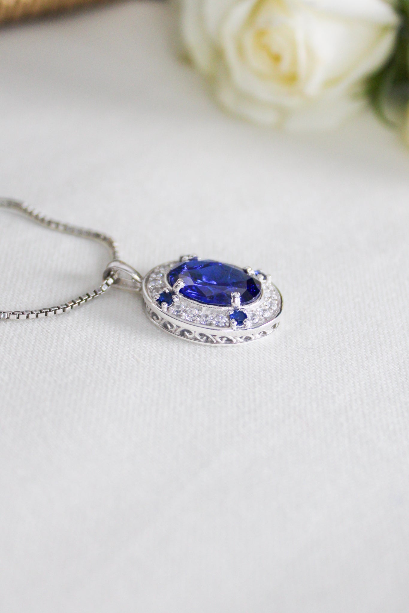 Close-up of silver Heartline Necklace inspired by Princess Diana’s iconic sapphire jewelry, Ether Jewelry