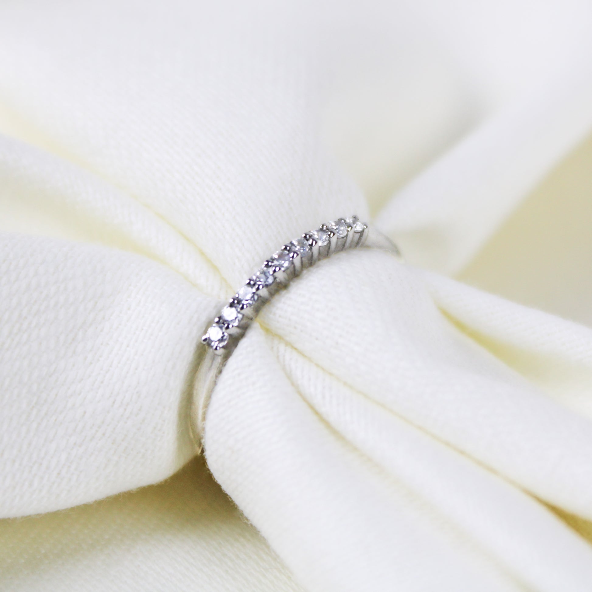Heirloom Arc Stacker in sterling silver, delicate half eternity CZ band pulled through white fabric, Ether Jewelry