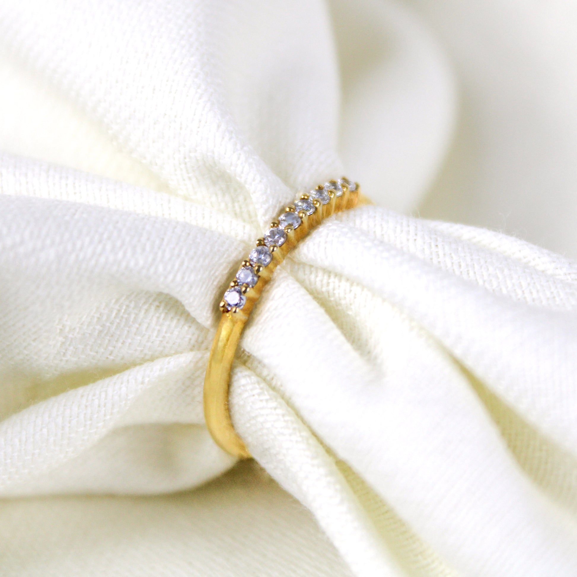 Heirloom Arc Stacker in 18k gold vermeil, delicate half eternity CZ band pulled through white fabric, Ether Jewelry