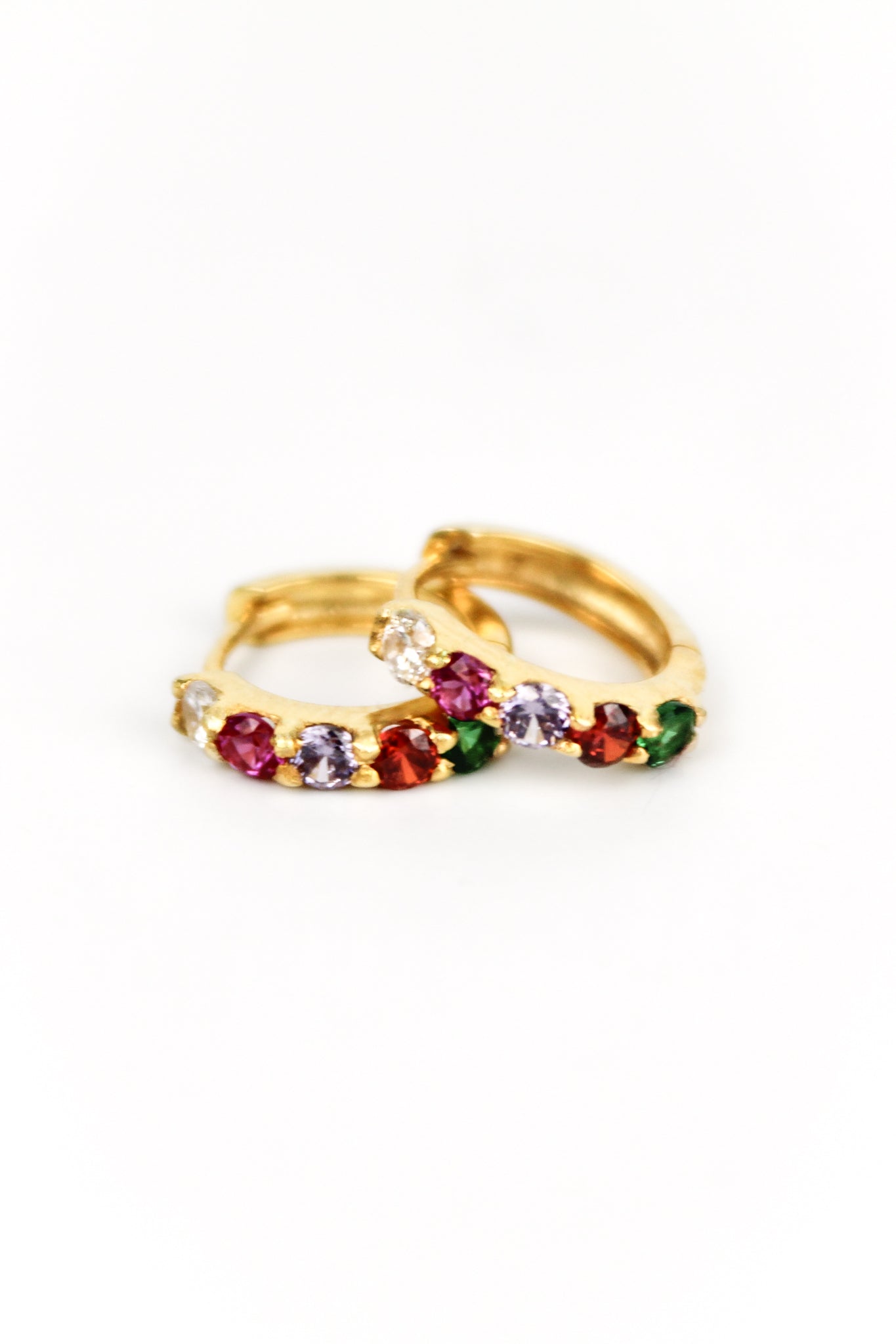 Regard Huggies 18k gold vermeil earrings stacked on top of each other, colorful acrostic REGARD CZ huggie hoops, Ether Jewelry
