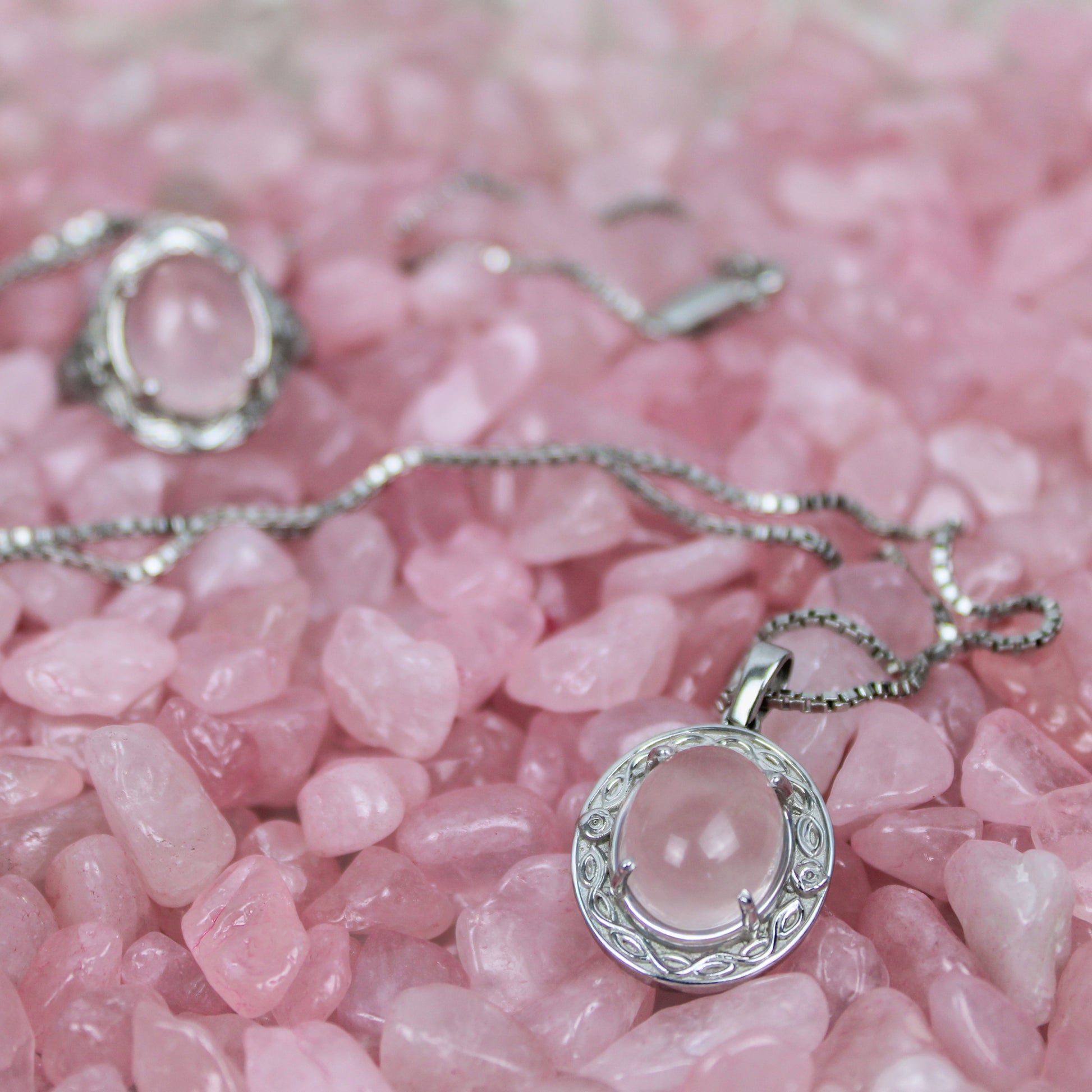 Sterling Silver Romantic Heir necklace with a pink quartz pendant on pink stones
