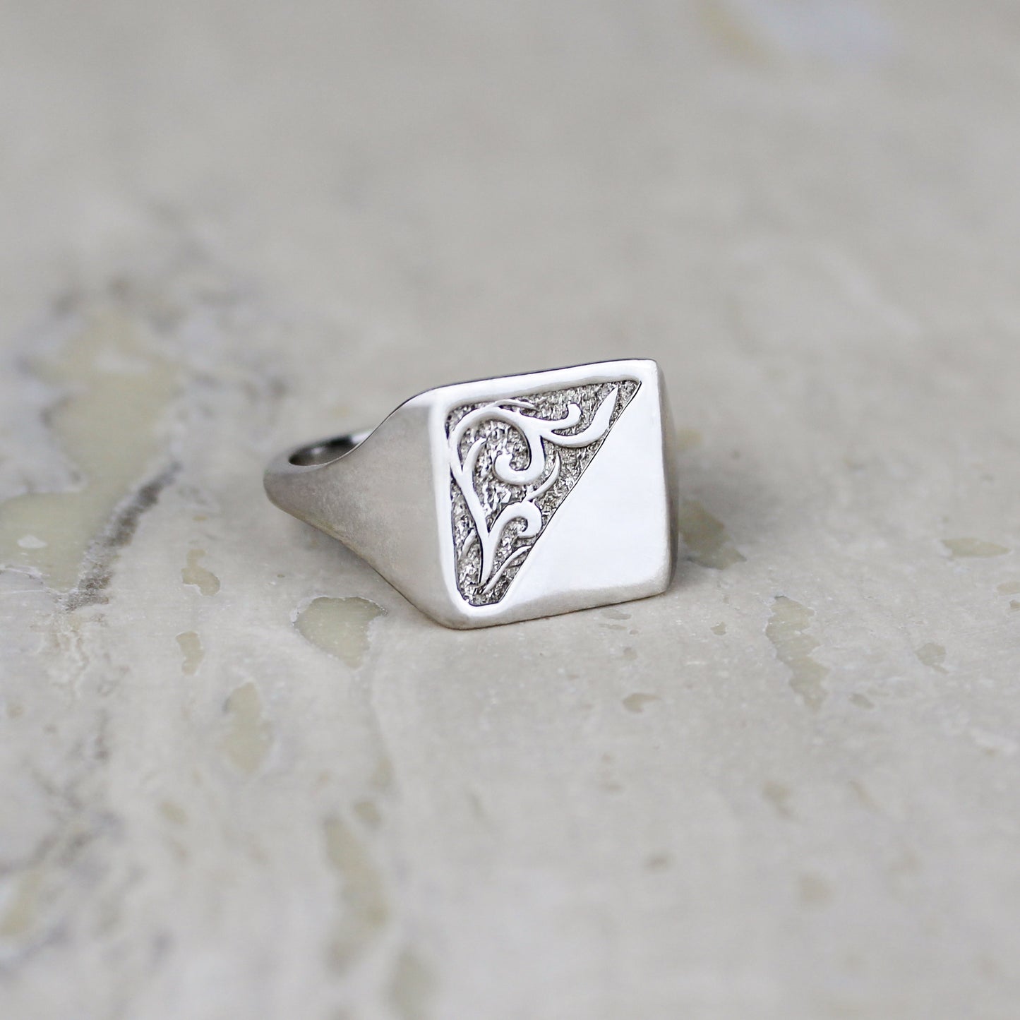 Architect Ring sterling silver staged on marble, square signet ring with diagonal scroll engraving, Ether Jewelry