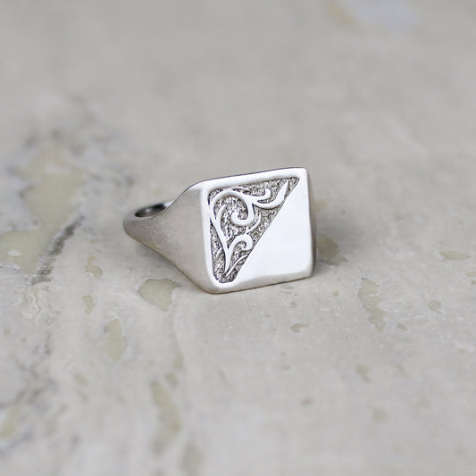 Architect Ring sterling silver staged on marble, square signet ring with diagonal scroll engraving, Ether Jewelry