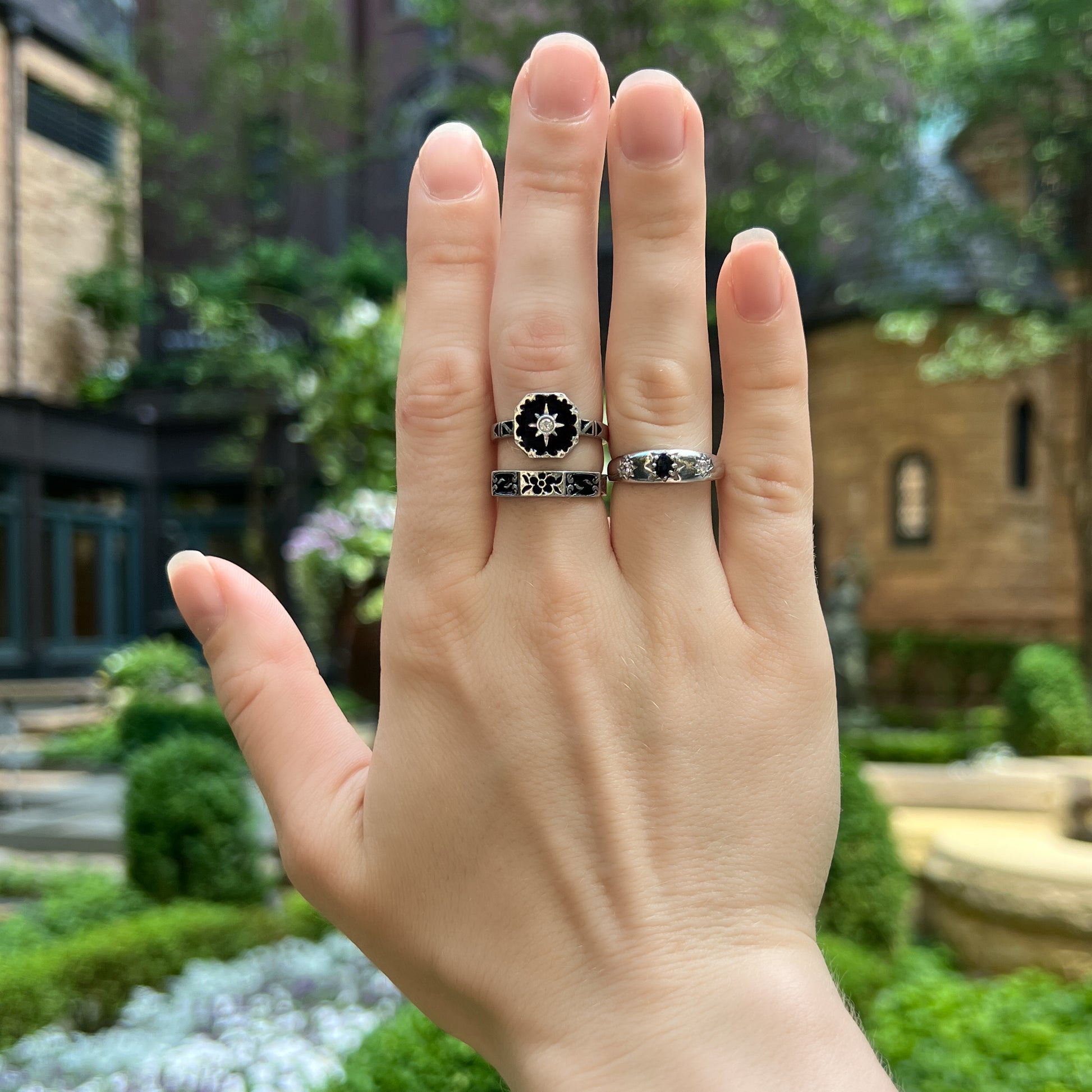 Sterling silver Midnight Roma ring worn in front of old building, Victorian mourning jewelry, Ether Jewelry