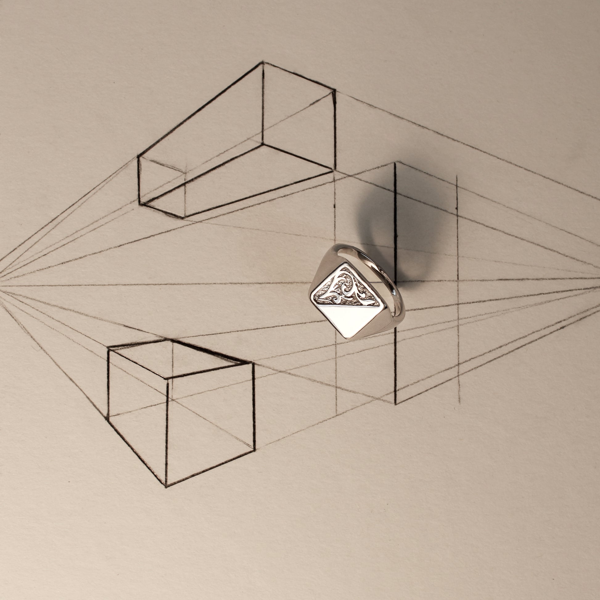 sterling Silver architect signet ring with a geometric design on a beige background with architect sketch of squares