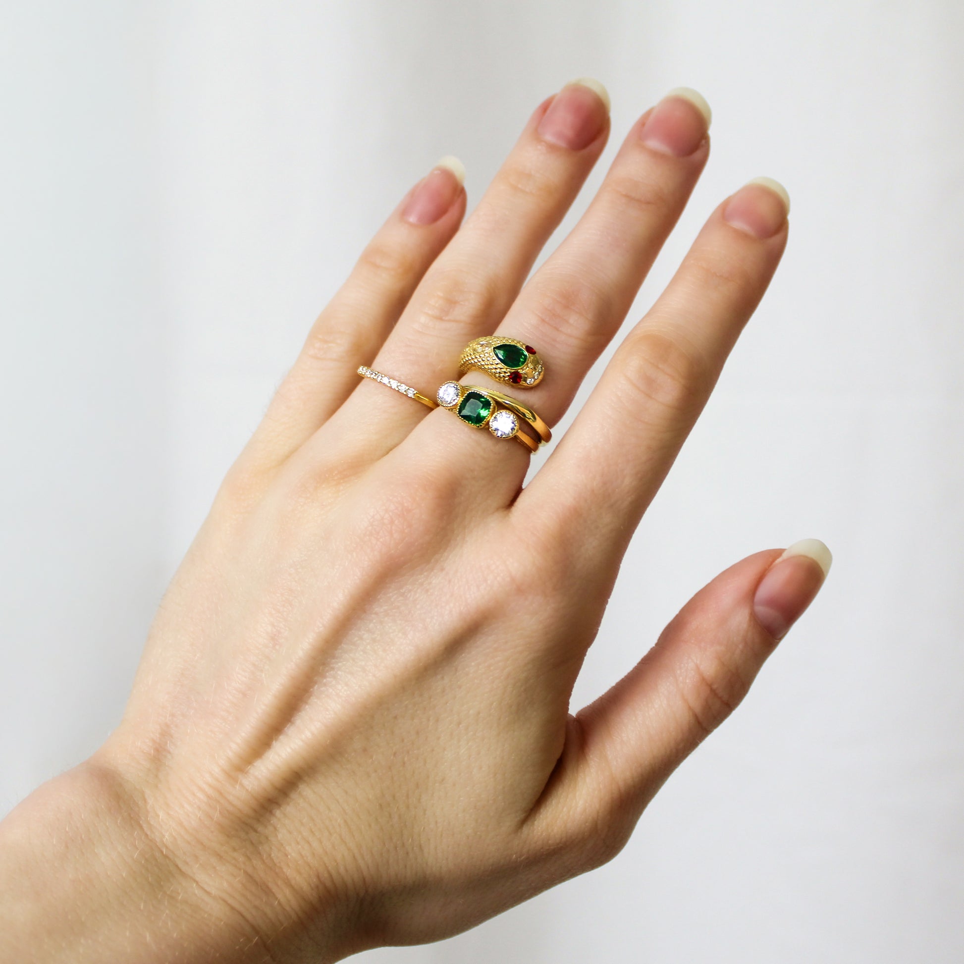 18k gold vermeil Heirloom Arc Stacker stacked with Queen Victoria and Edwardian Three Stone ring on model hand, Ether Jewelry