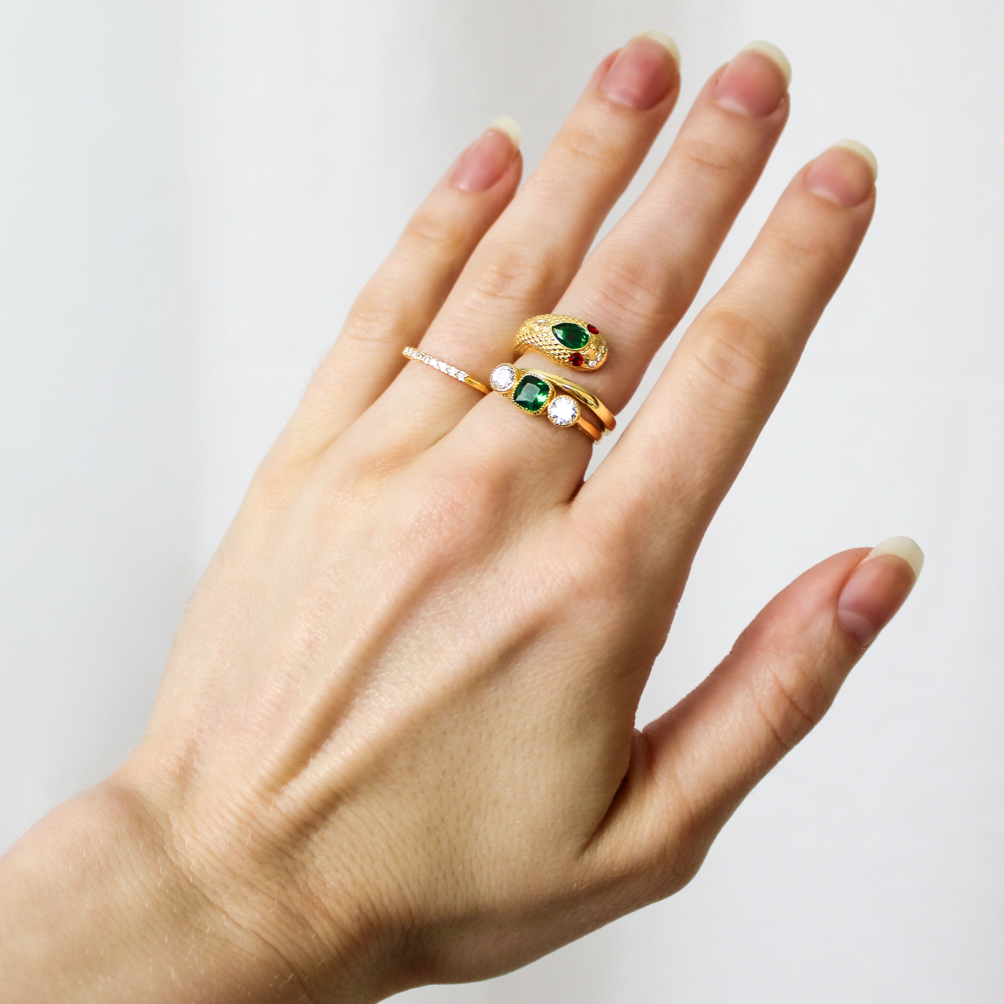 18k gold vermeil Heirloom Arc Stacker stacked with Queen Victoria and Edwardian Three Stone ring on model hand, Ether Jewelry