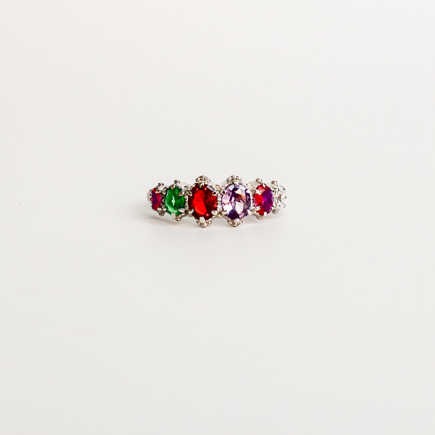 Crowned Jewel Ring in sterling silver, acrostic REGARD oval-cut CZ stones in graduating crown prong band, Ether Jewelry