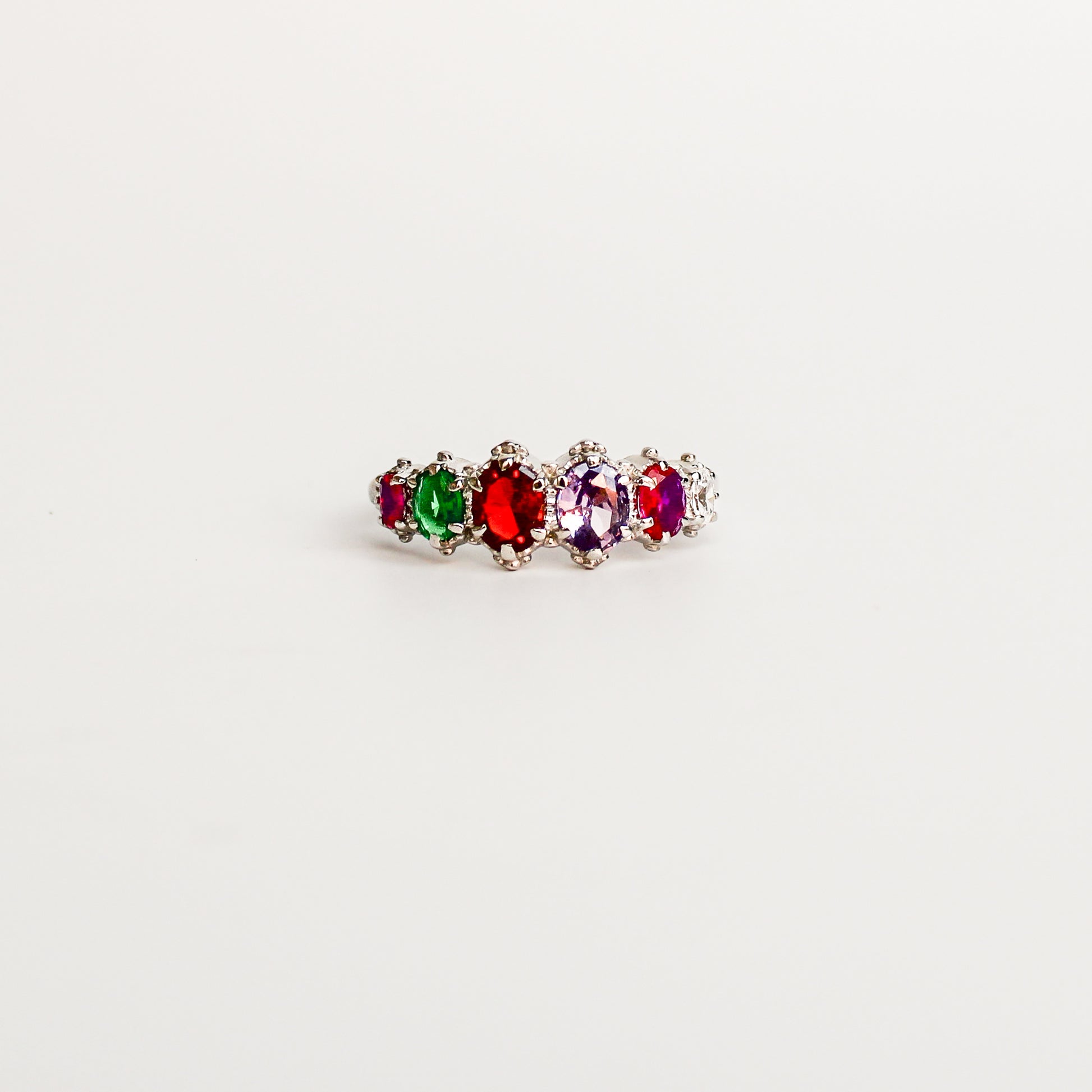 Crowned Jewel Ring in sterling silver, acrostic REGARD oval-cut CZ stones in graduating crown prong band, Ether Jewelry