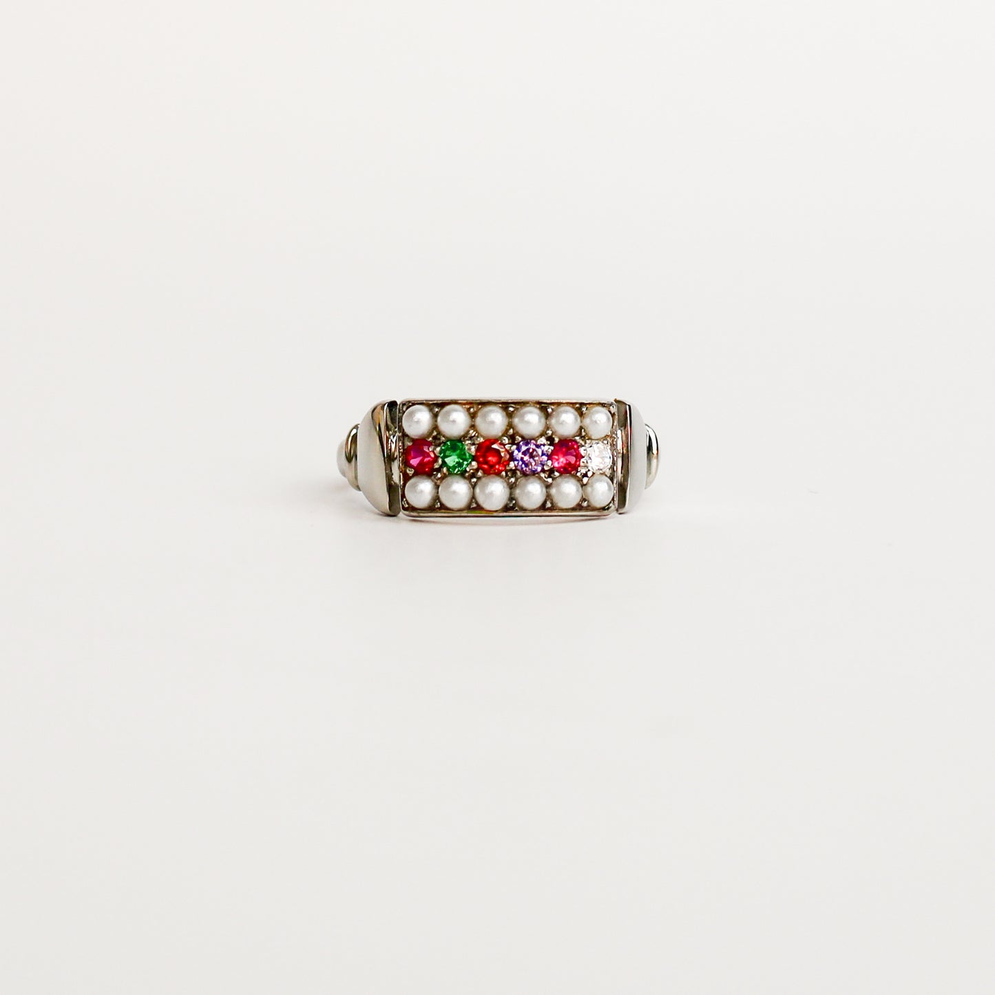 Regent Ring in sterling silver, acrostic REGARD CZ stones set across cultured pearl-paved rectangular signet face, Ether Jewelry