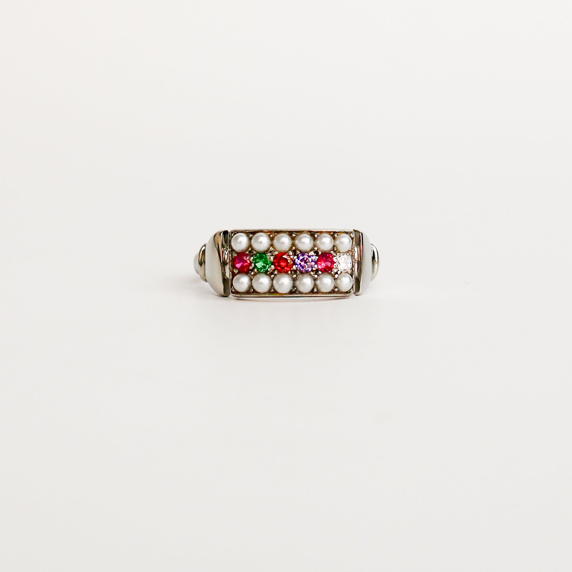 Regent Ring in sterling silver, acrostic REGARD CZ stones set across cultured pearl-paved rectangular signet face, Ether Jewelry