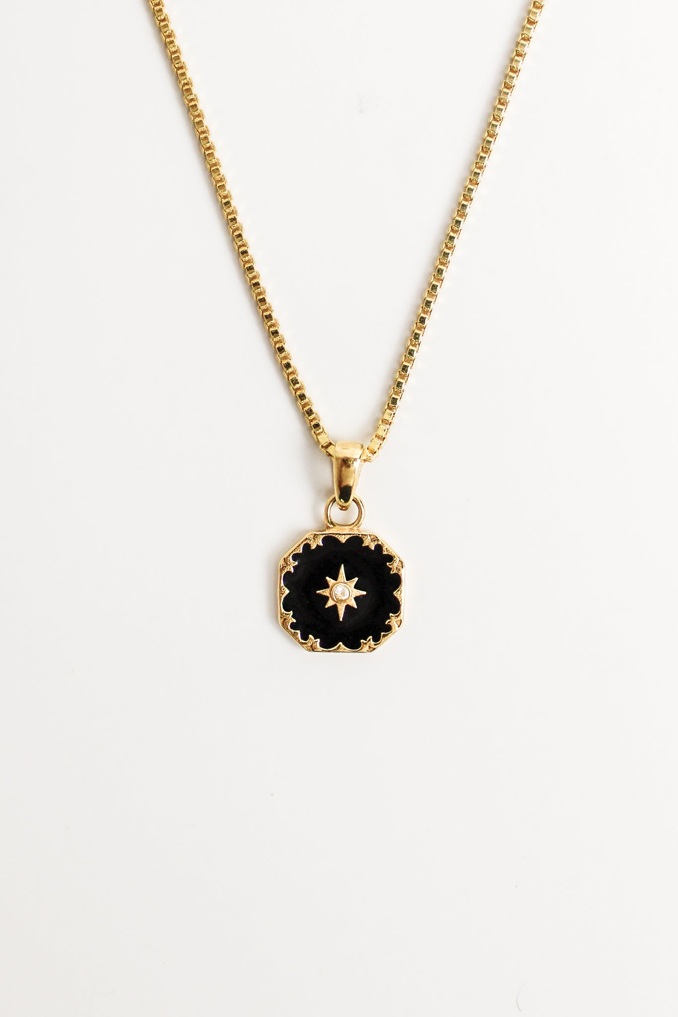 Nocturne Necklace in 18k gold vermeil, black enamel octagonal pendant with scalloped edge and star-set CZ center on box chain, Ether Jewelry
