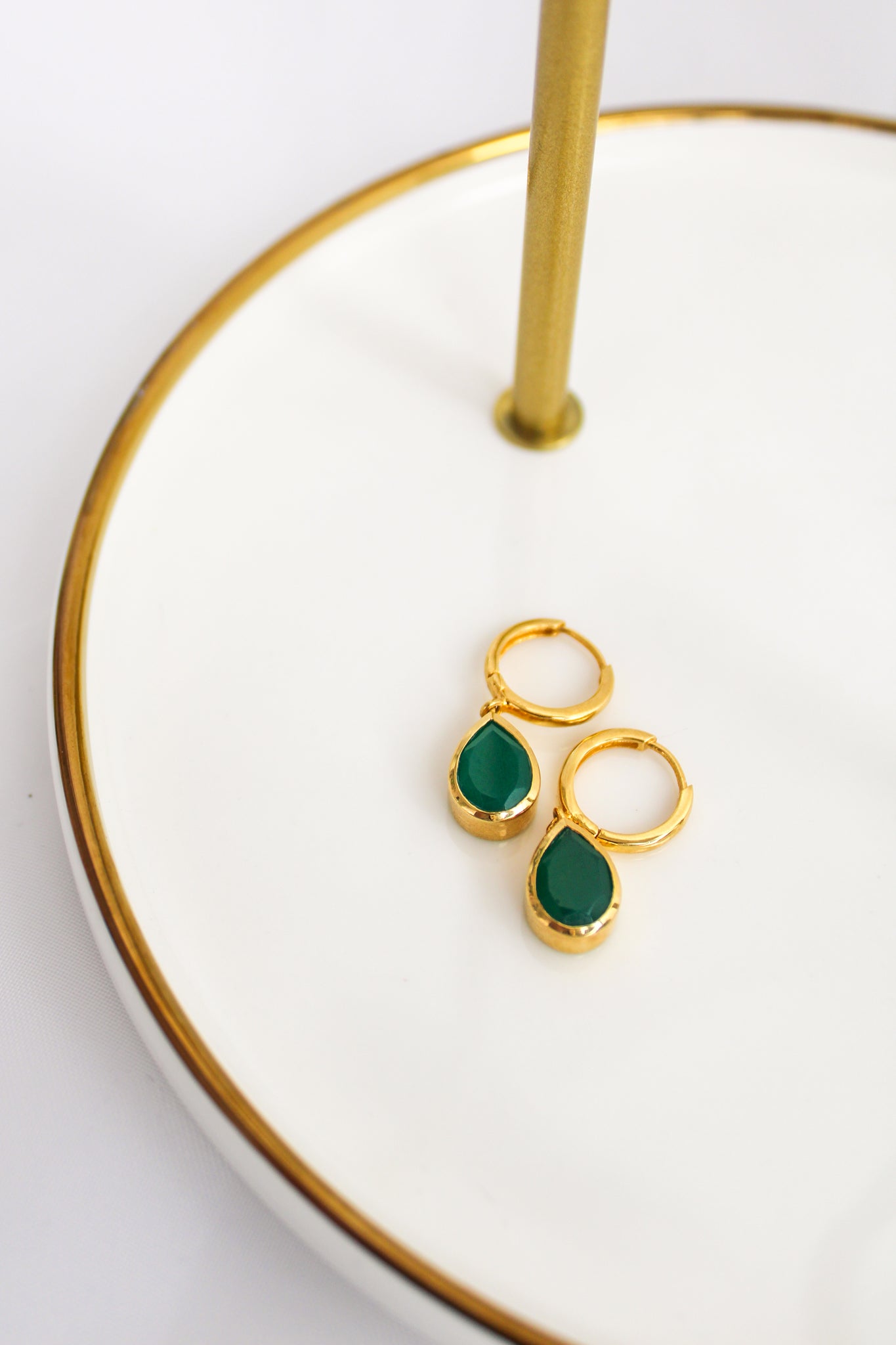 Devoted Earrings in 18k gold vermeil staged on white jewelry tray, bezel-set green onyx teardrop drops, Ether Jewelry