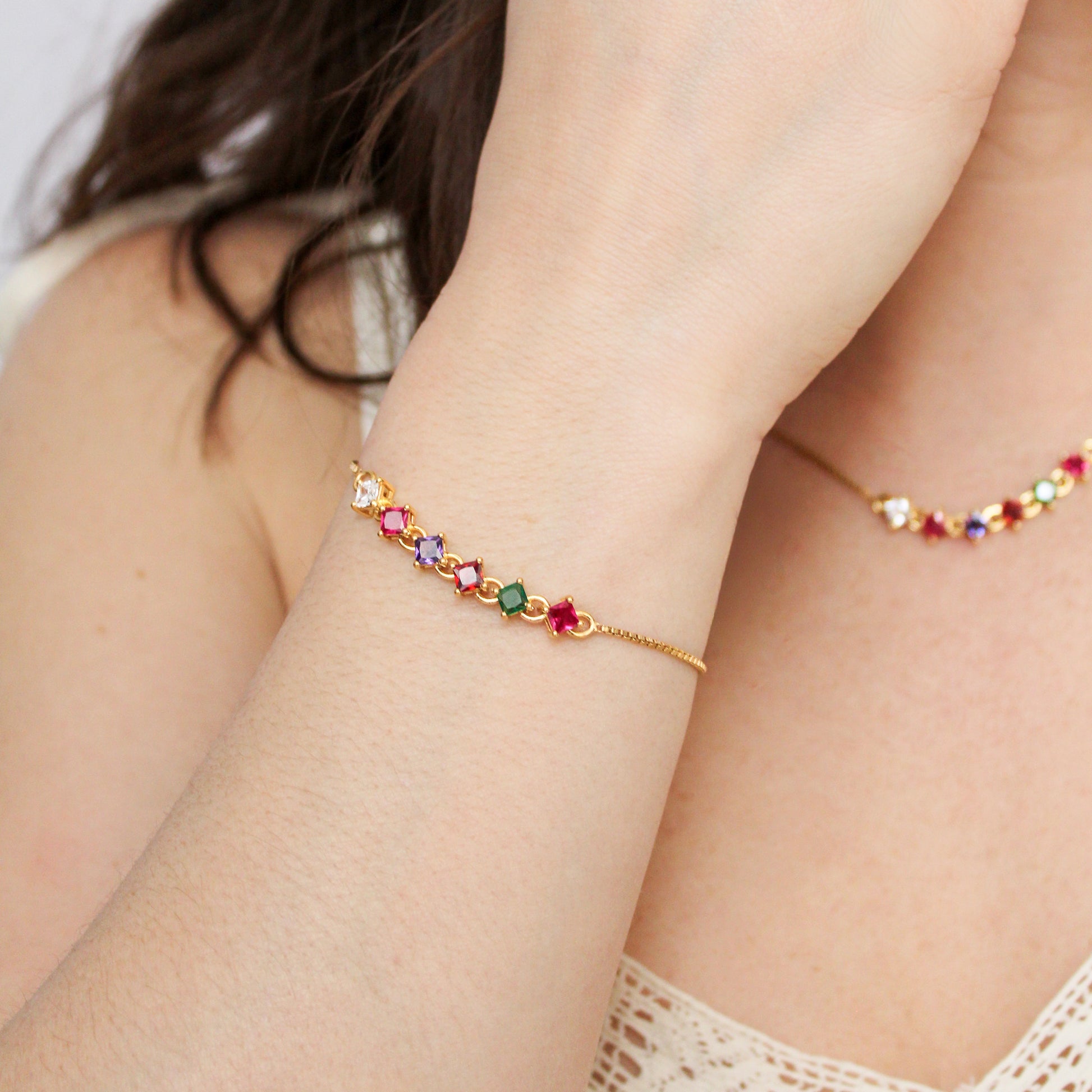 Linked Love Bracelet in 18k gold vermeil on model holding wrist up, acrostic REGARD CZ bracelet with Linked Love Necklace in background, Ether Jewelry