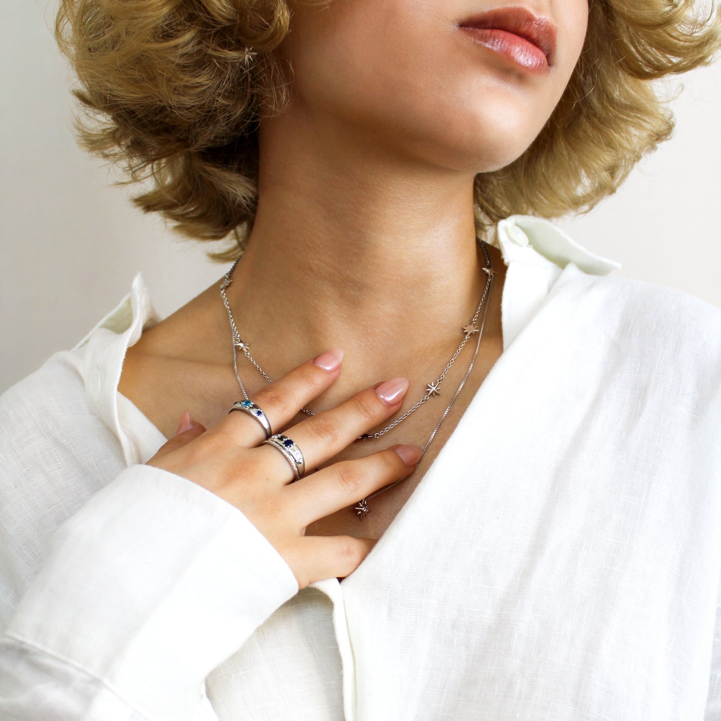 Sterling silver Letters from Roma Ring. and Victorian Roma Ring close-up on model hand, three stone gypsy set domed band, Ether Jewelry