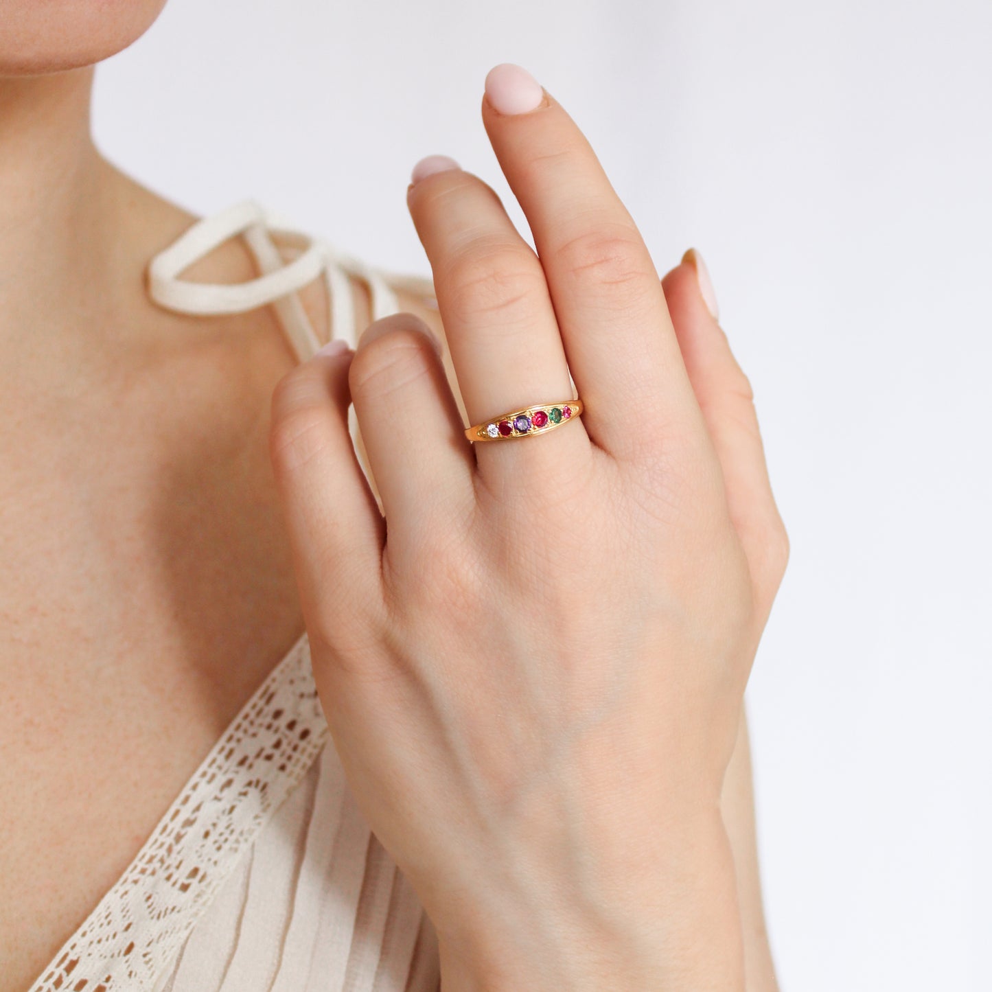18k gold vermeil Love Letter Ring on model holding up hand, colorful acrostic gemstone band, Ether Jewelry